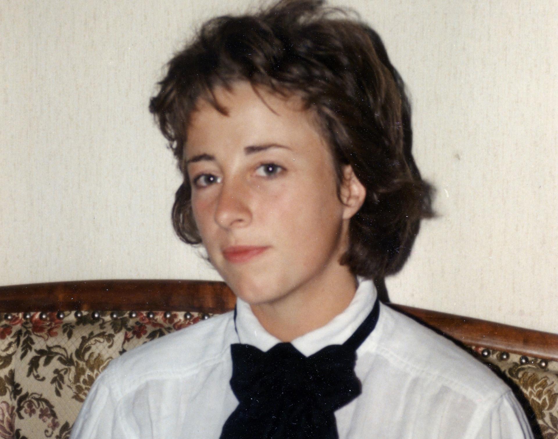 A portrait photo of Gabi Hayes in a white shirt and black tie.