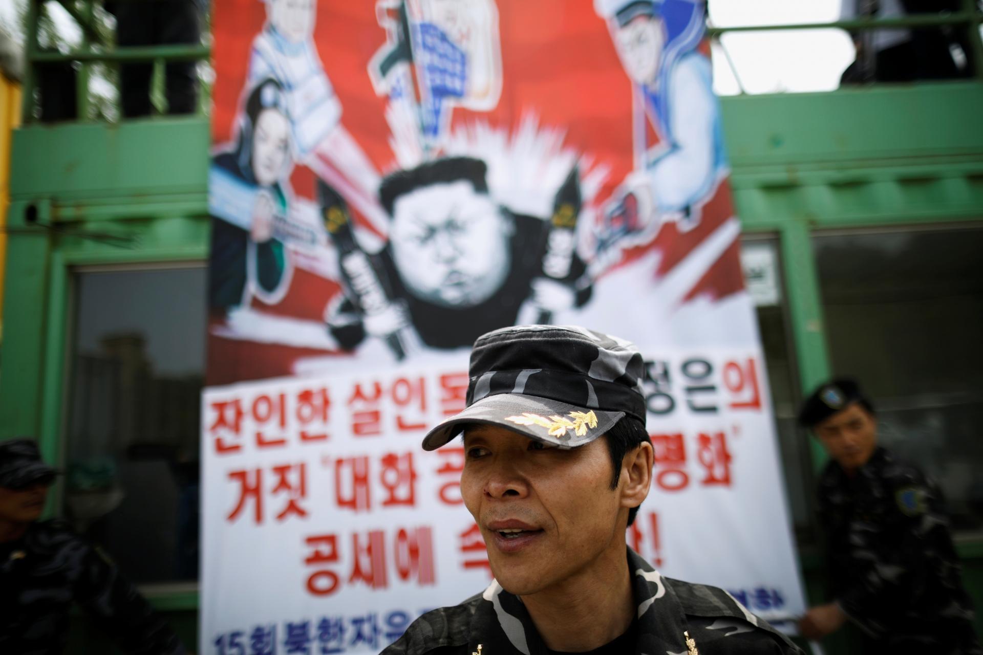 A North Korean defector, a member of an anti-North Korea civic group, prepares to release balloons containing leaflets denouncing North Korean leader Kim Jong-un