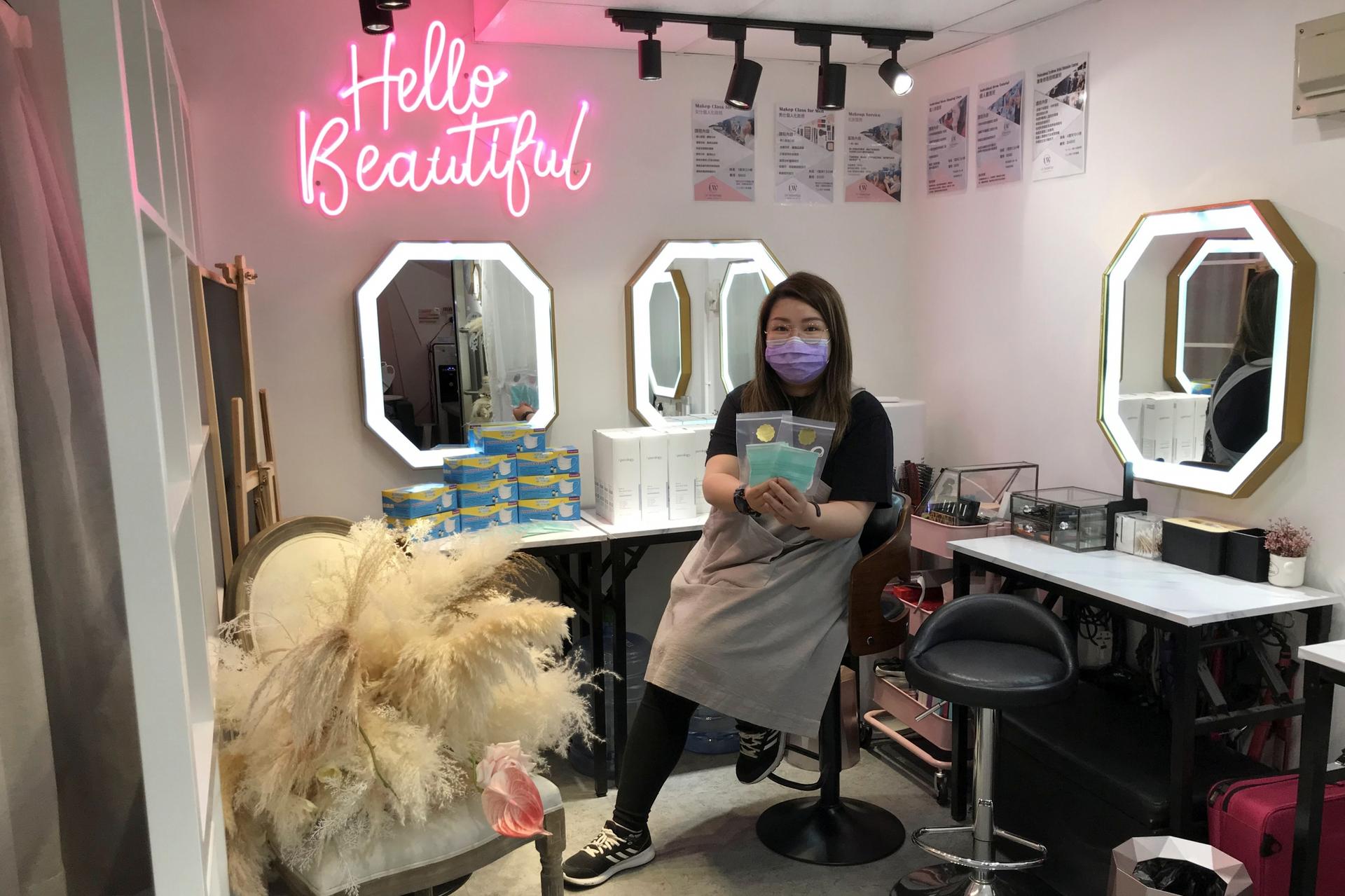 A woman sits in a beauty salon