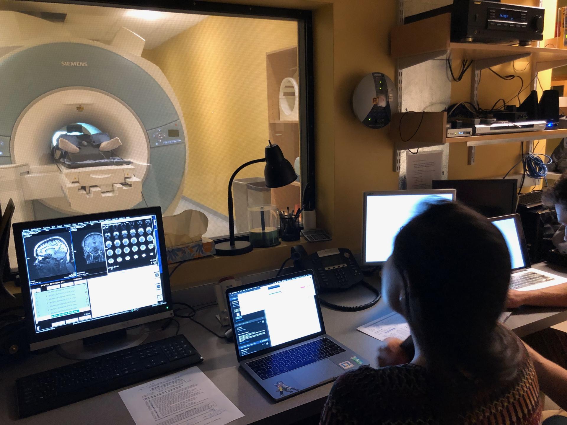 From the lab's control room, lab manager Hope Kean is shown at the controls with Susanna Zaraysky in the fMRI.