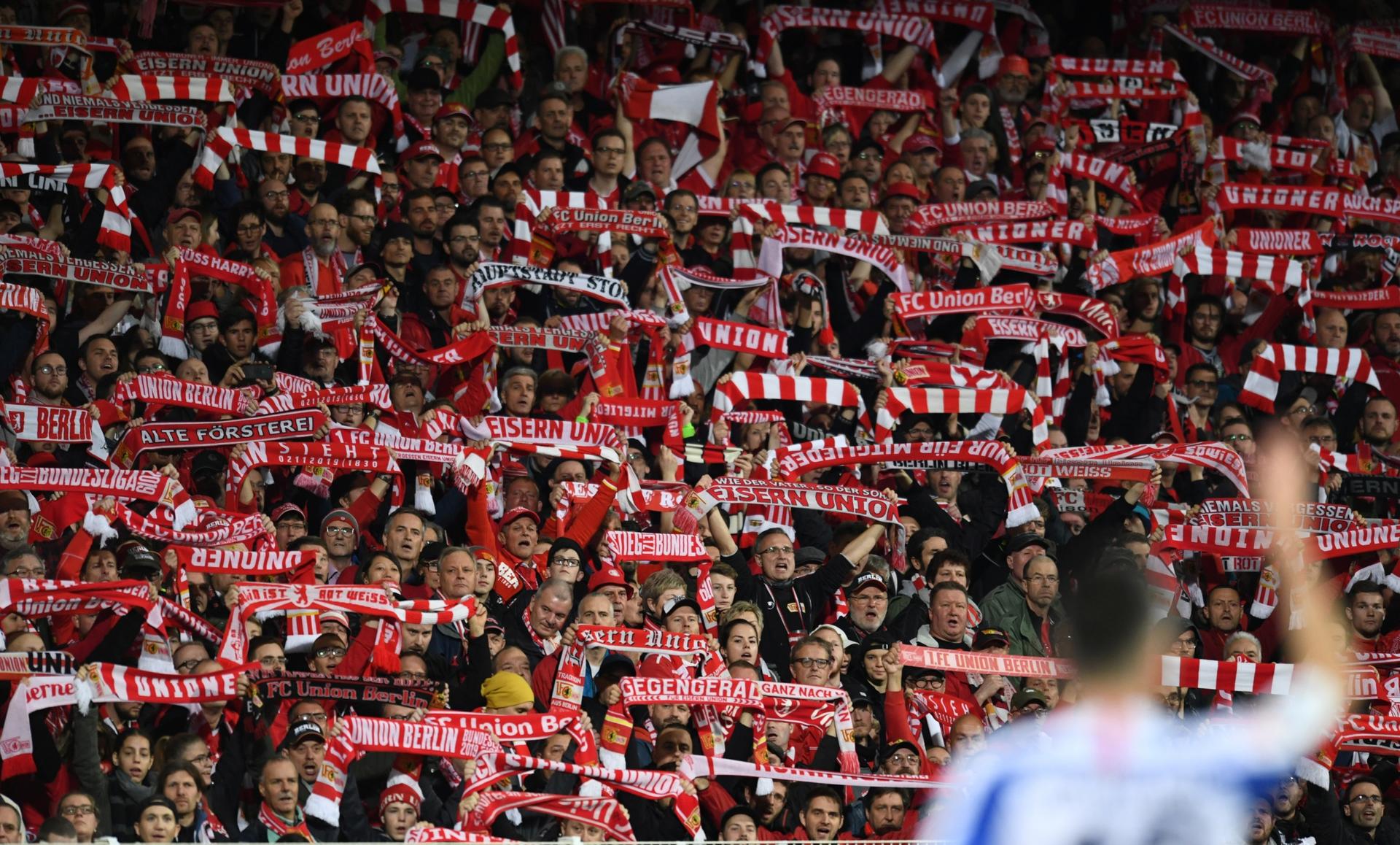 1. FC Union Berlin fans hold up their scarves during the match on Nov. 2, 2019, Berlin, Germany. 