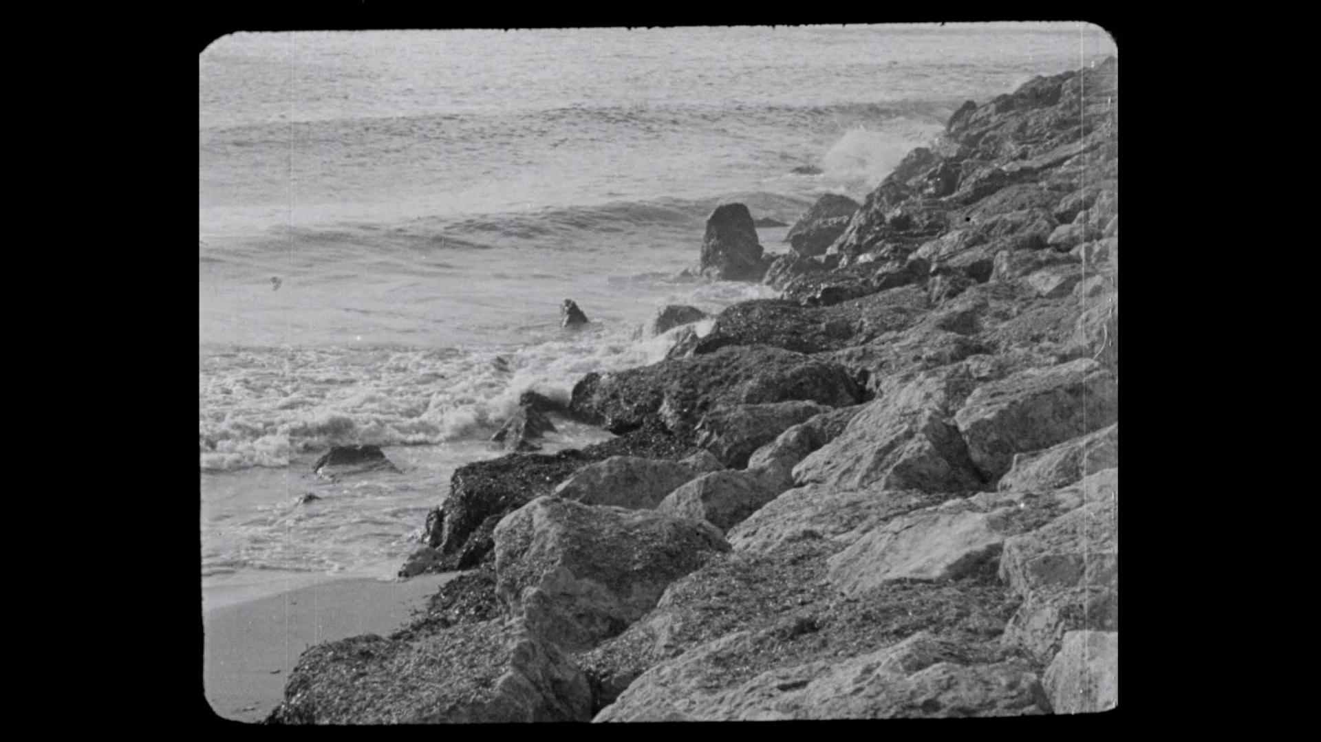 A seaside image from a black and white film. 