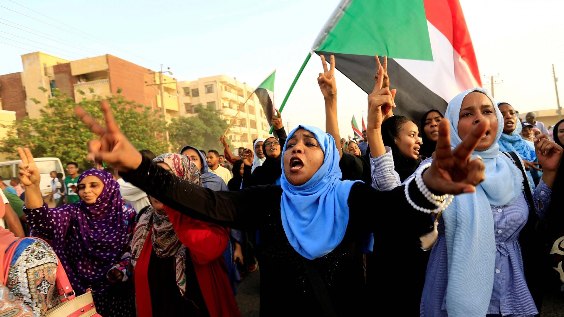 Sudanese protesters march during a demonstration to commemorate 40 days since the sit-in massacre in Khartoum North, Sudan, on July 13, 2019. 