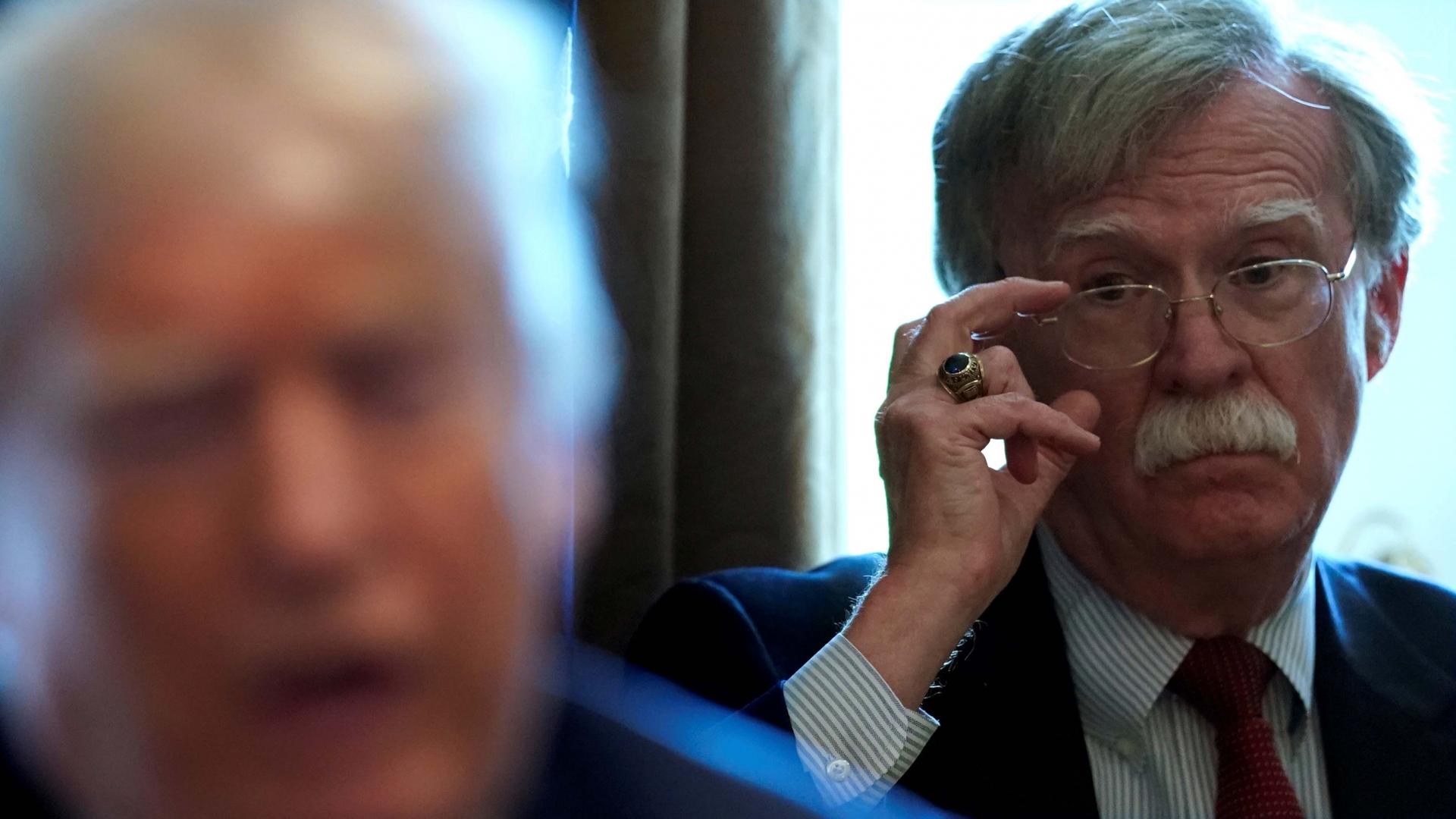 Then-National Security Adviser John Bolton listens as US President Donald Trump holds a Cabinet meeting at the White House in Washington, DC, on April 9, 2018.