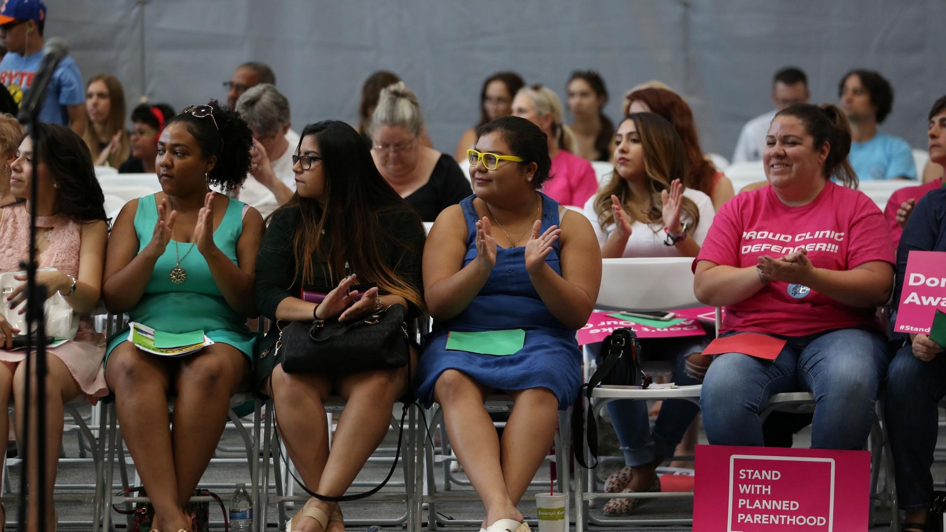 People attend a bilingual health care town hall sponsored by local organizations that work in Latino voter outreach, disability advocacy and community health at the Ability360 Center in Phoenix, July 5, 2017. Senators John McCain and Jeff Flake were invit