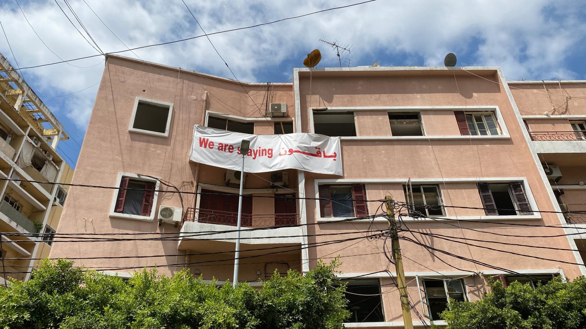 Defiant signs in a part of Beirut beset by rumors that developers are trying to push residents out. 