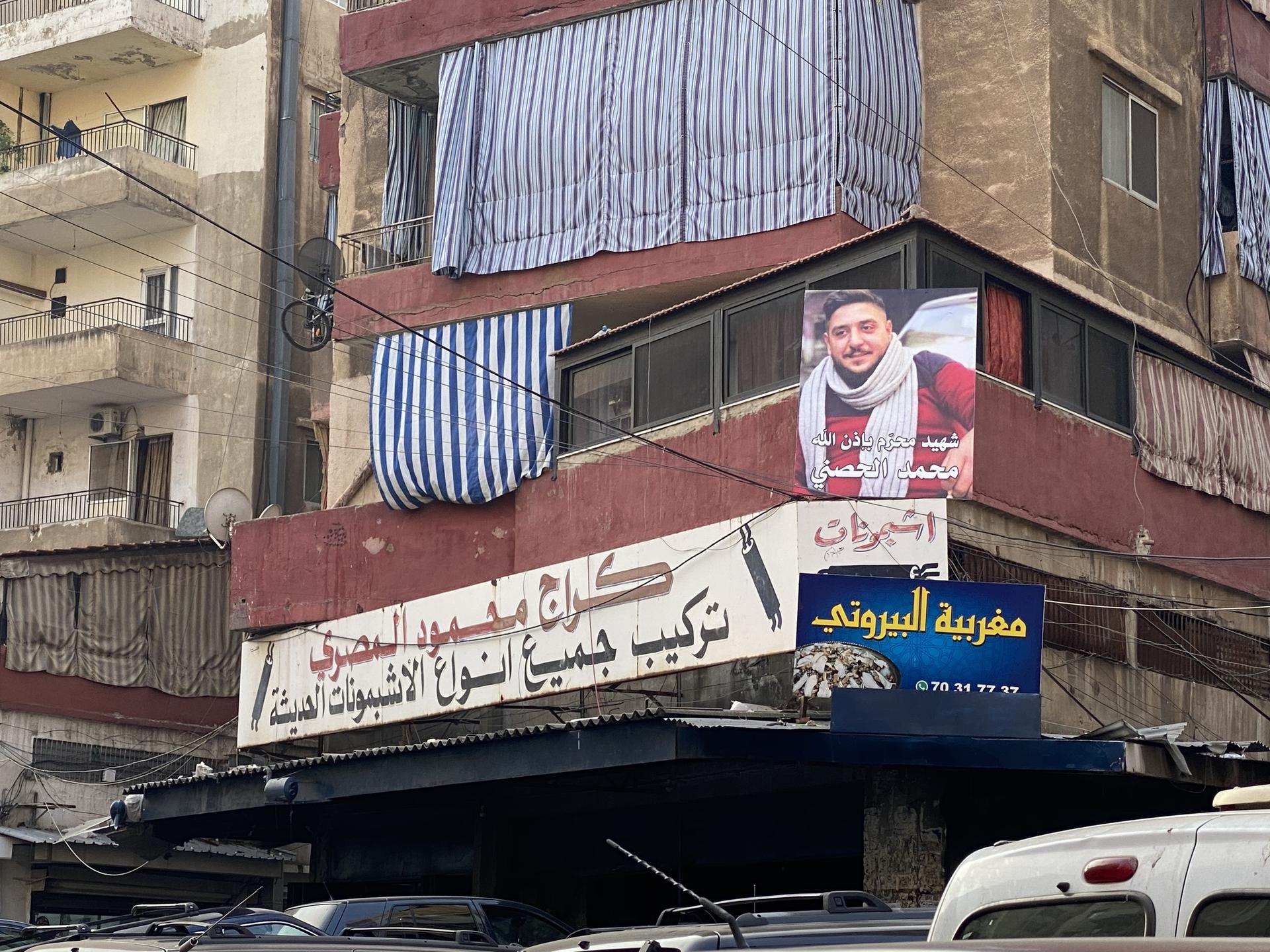 A picture of Mohammed Hosni hangs in the streets of his Tripoli neighborhood.