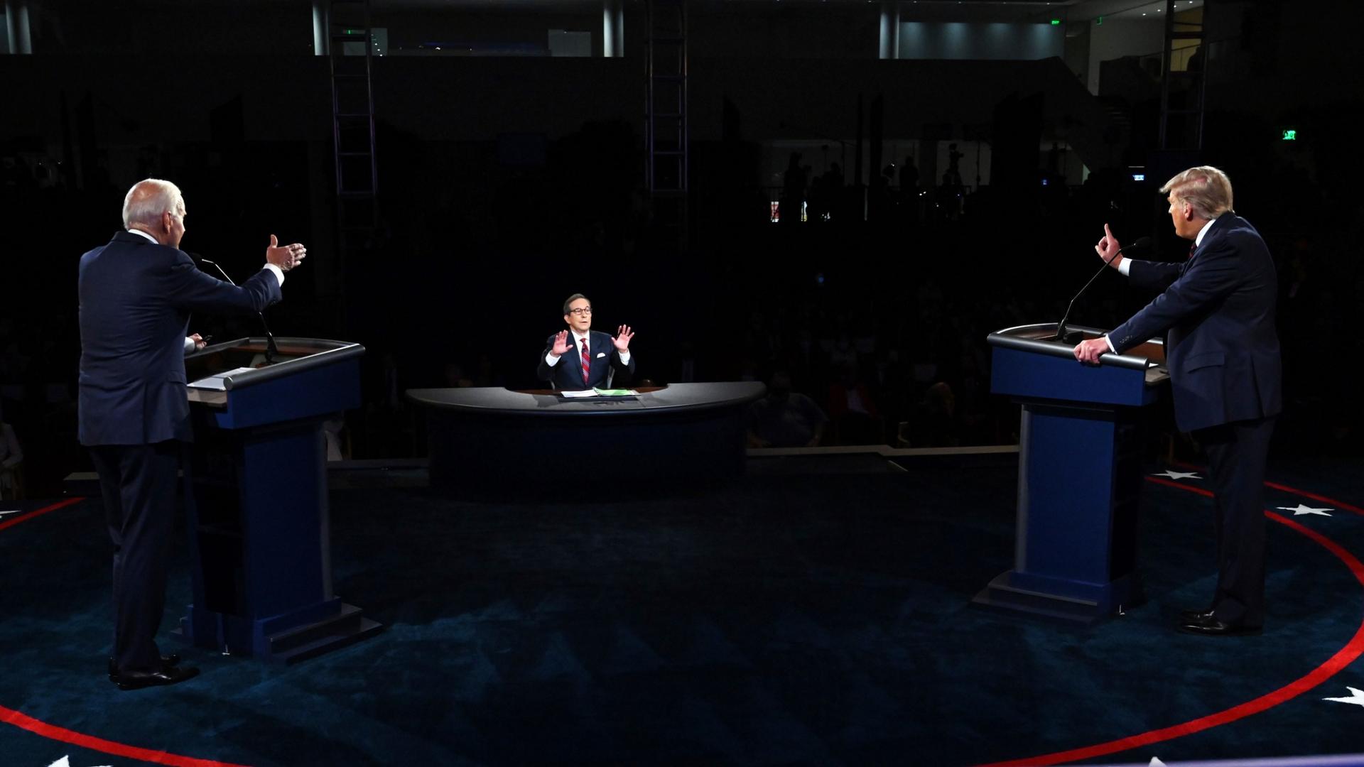 President Donald Trump and Democratic presidential candidate former Vice President Joe Biden are shown on either side of the photo, each standing at a podium and facing a moderator.