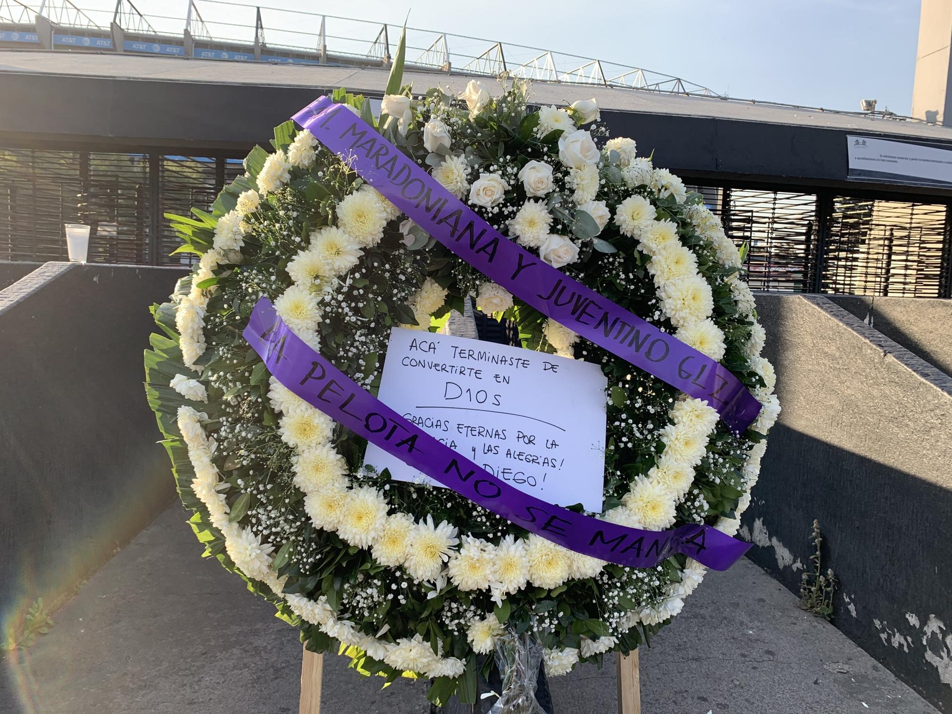 A wreath for Diego Maradona reading, "This is where you became God" sits outside Estadio Azteca, the stadium where Maradona led Argentina to defeat England in the 1986 World Cup, in Mexico City, Mexico, Nov. 26, 2020.