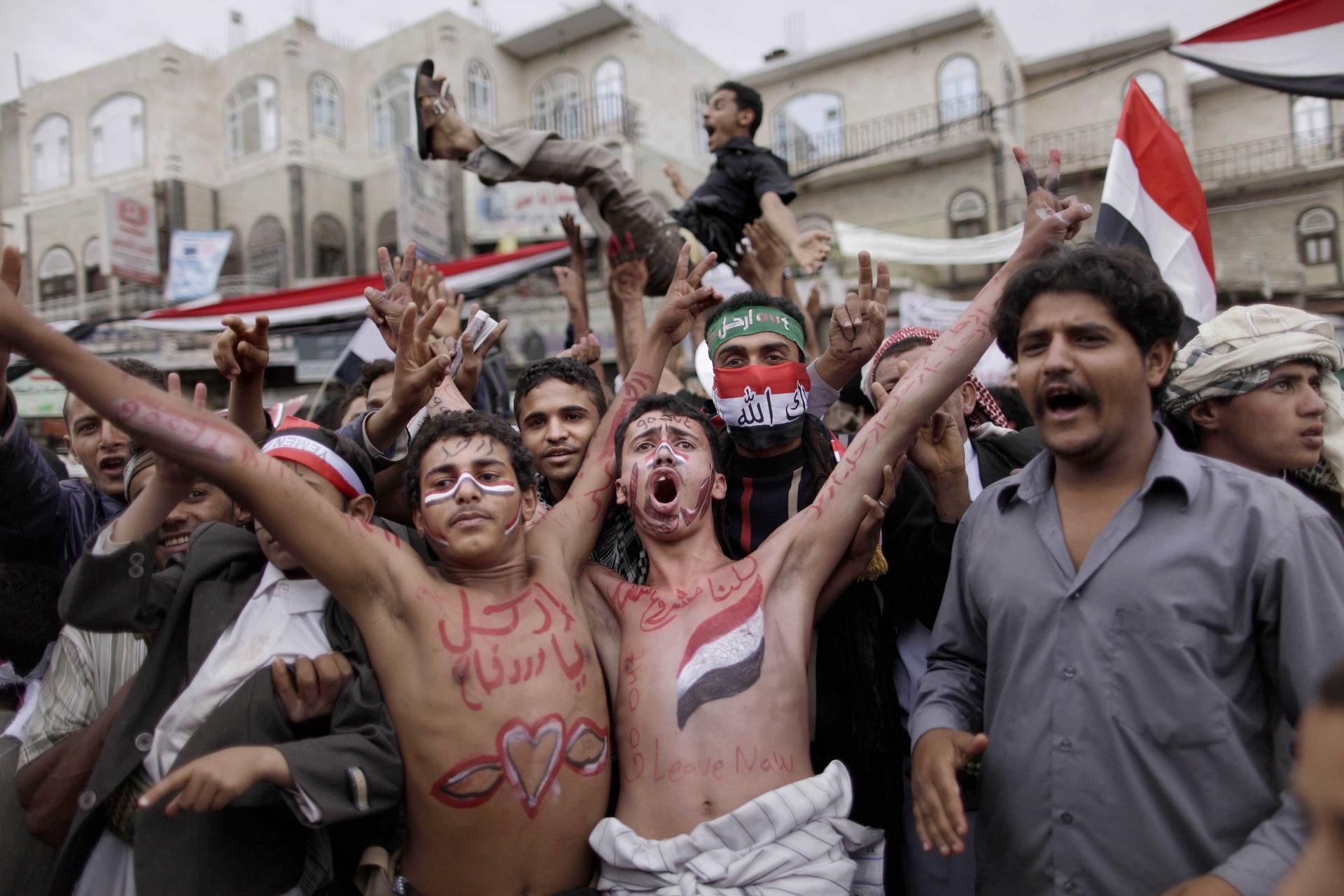 In this March 26, 2011 file photo, anti-government protestors react during a demonstration demanding the resignation of Yemeni President Ali Abdullah Saleh, in Sanaa, Yemen.