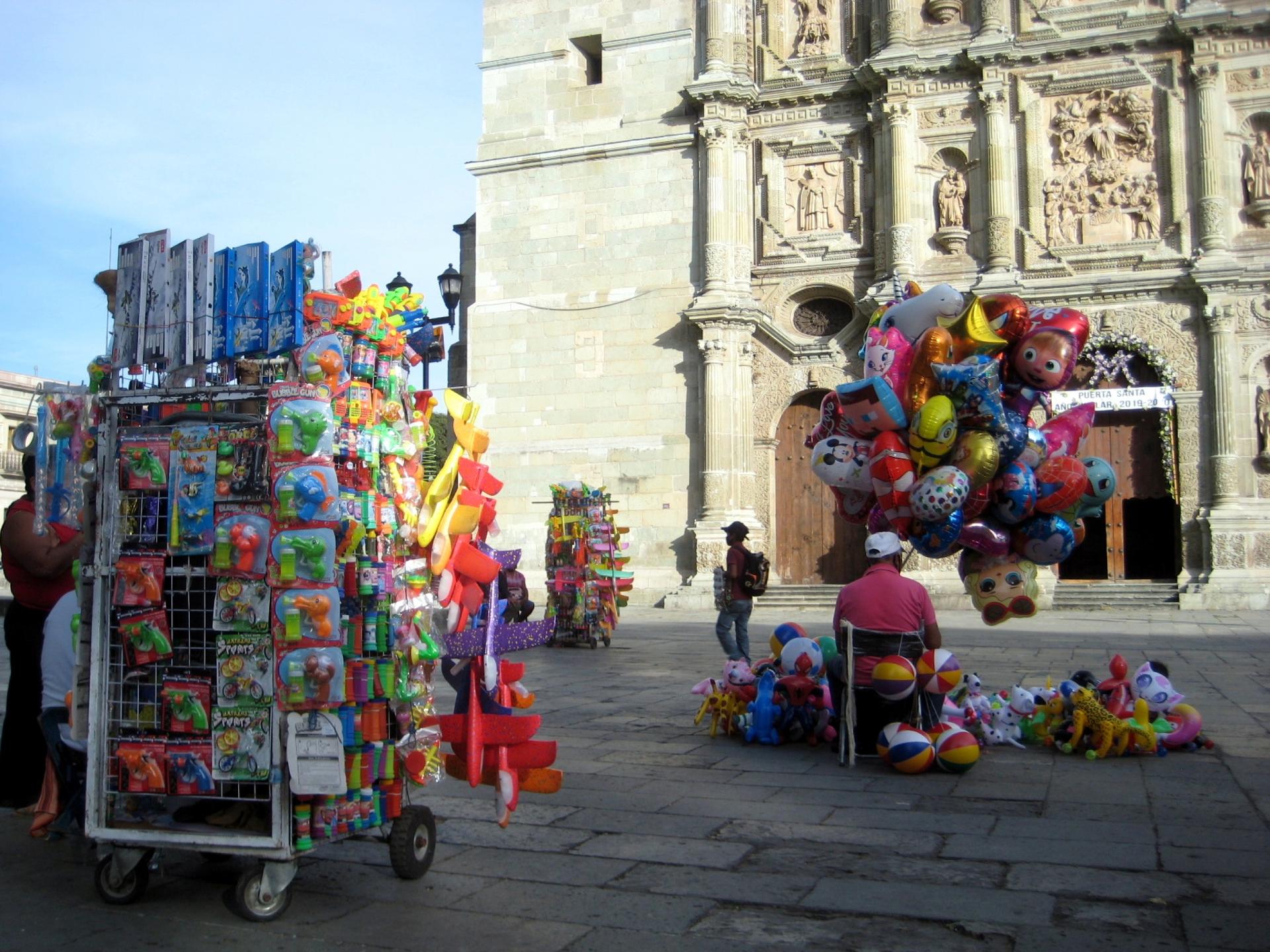 Vendors in front of Oaxaca's landmark cathedral have been outnumbering potential clients these days. 