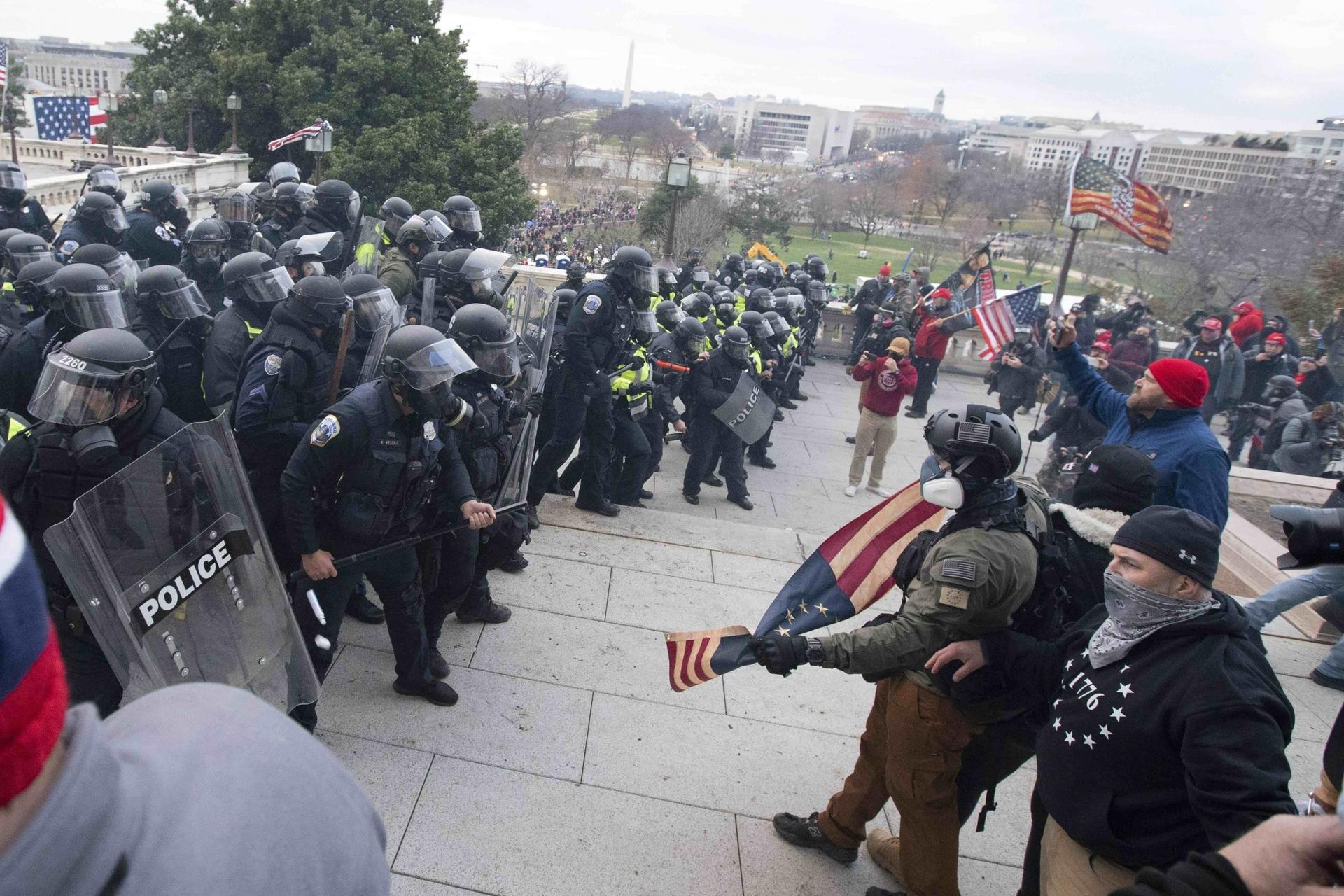 US Capitol Police push back rioters who were trying to enter the US Capitol on Wednesday, Jan. 6, 2021, in Washington, DC. 