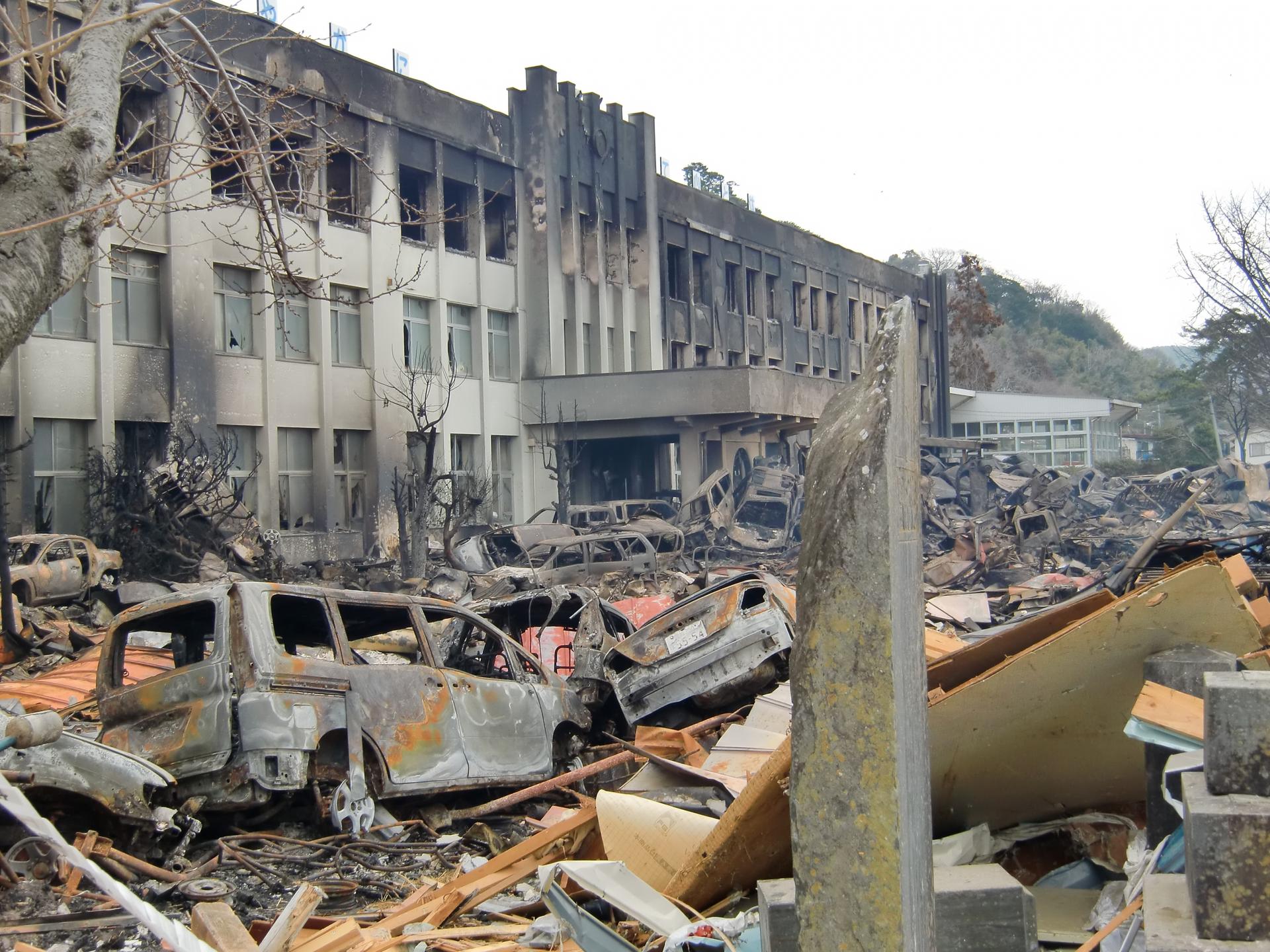 A school is shown completely burned out with no windows.