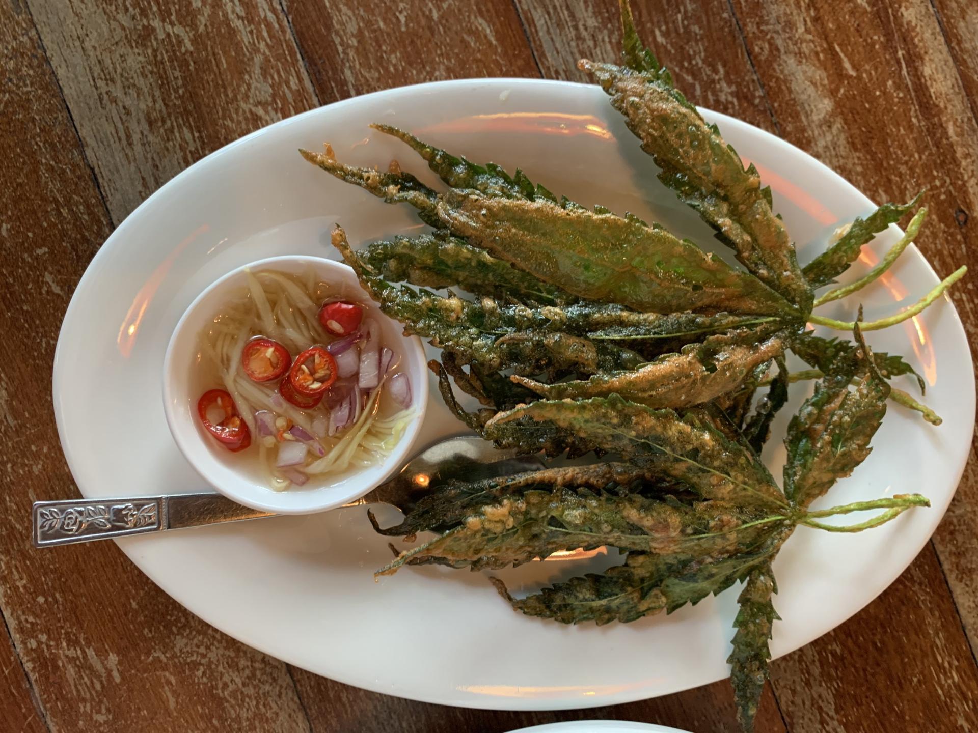 Cannabis leaves are incorporated into dishes at a restaurant called Baan Lao Ruang (The Storytelling House) in a rural area outside of Bangkok. 