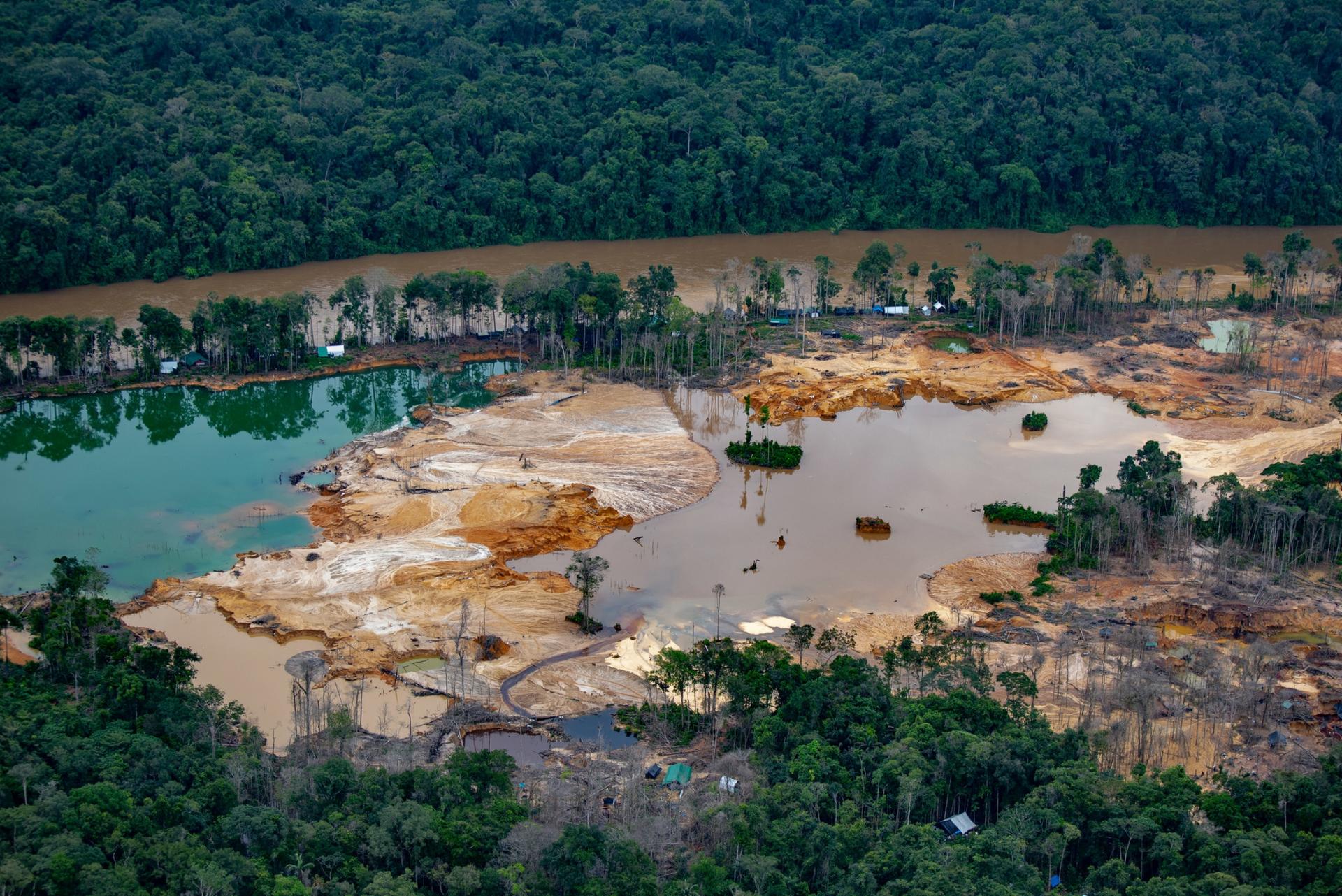 Environmental devastation caused by illegal mining operations in Yanomami land. 