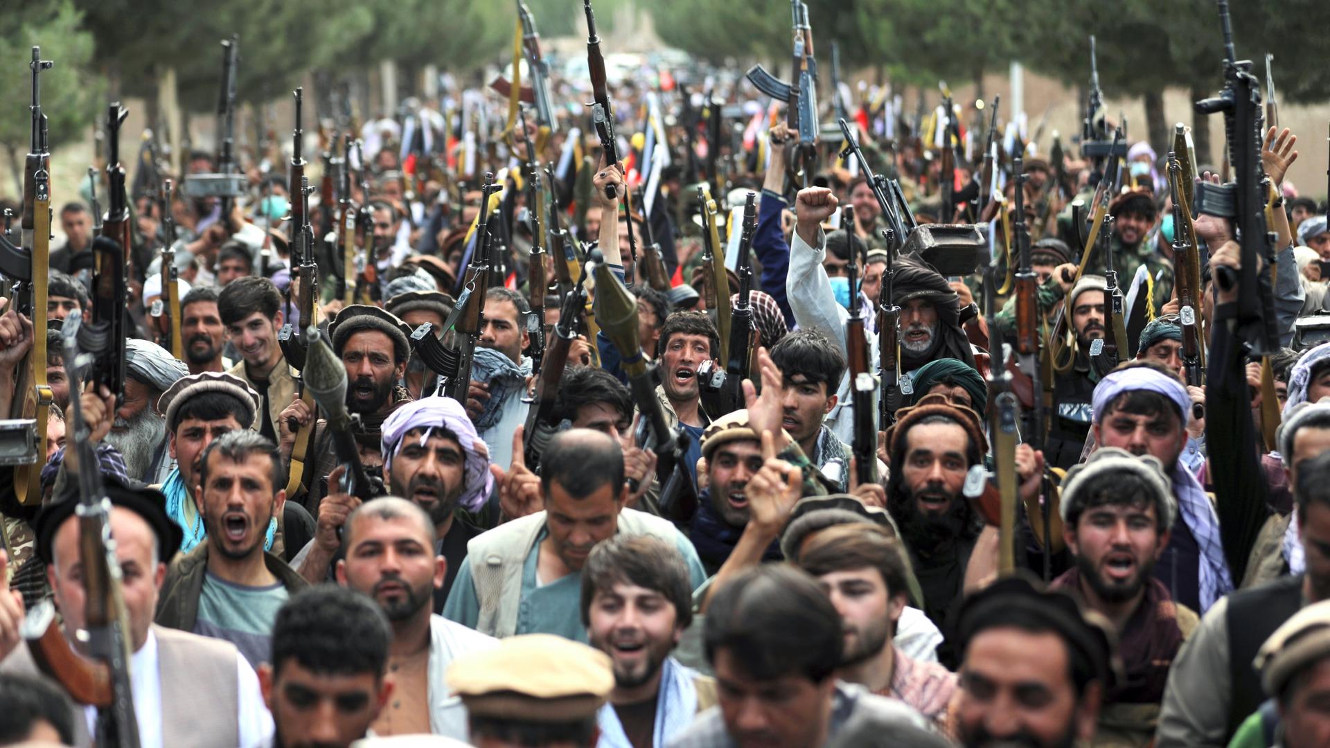 Afghan militiamen join Afghan defense and security forces during a gathering in Kabul, Afghanistan, June 23, 2021. Afghanistan's defense ministry is working with warlords to mobilize local militias across the country, most particularly in the north, to tr
