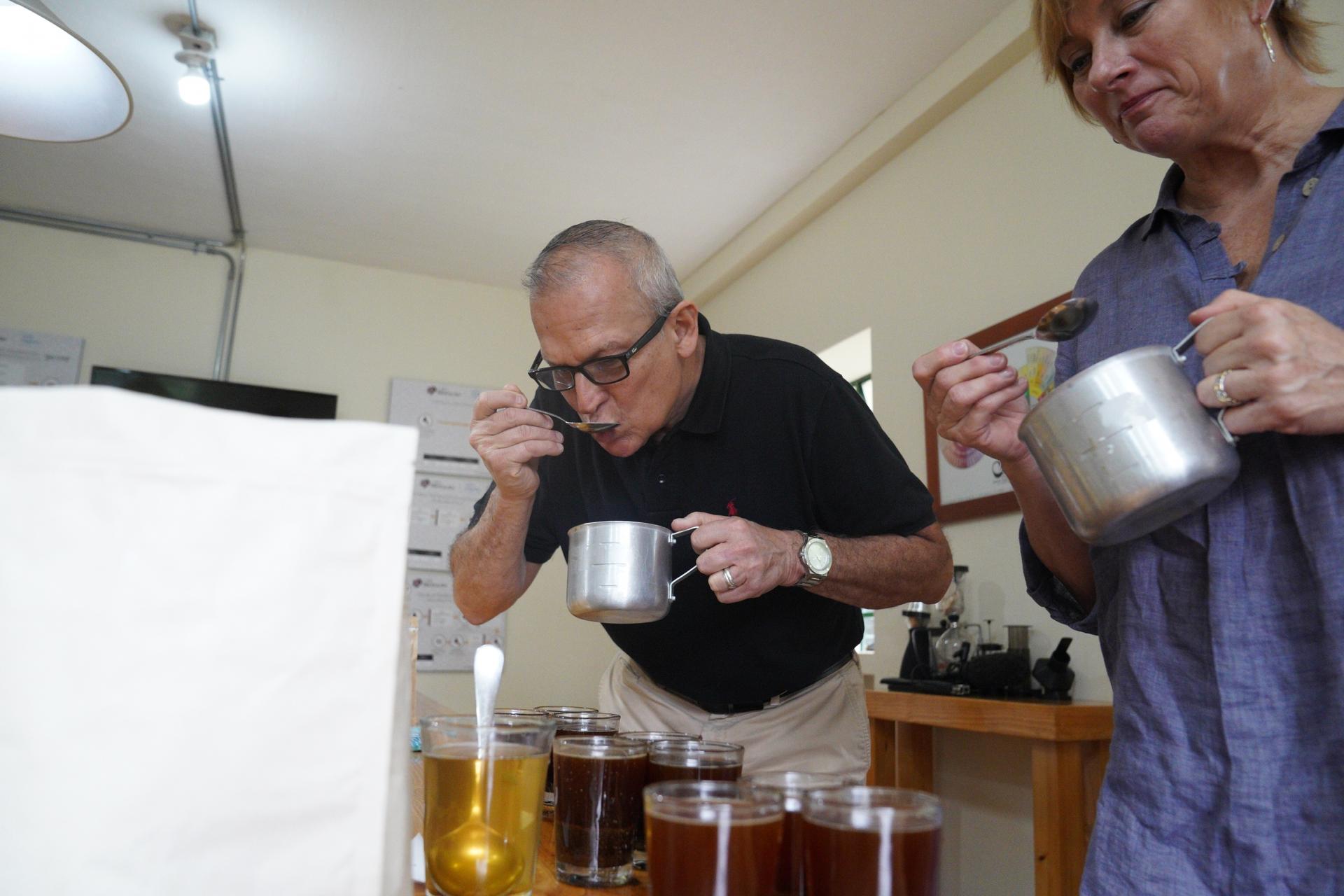 Mauricio Zuñiga tastes different kinds of coffee at a lab near Cali, Colombia on May 27, 2021. These cupping sessions help him to come up with ideas for the blends he exports to the United States. 