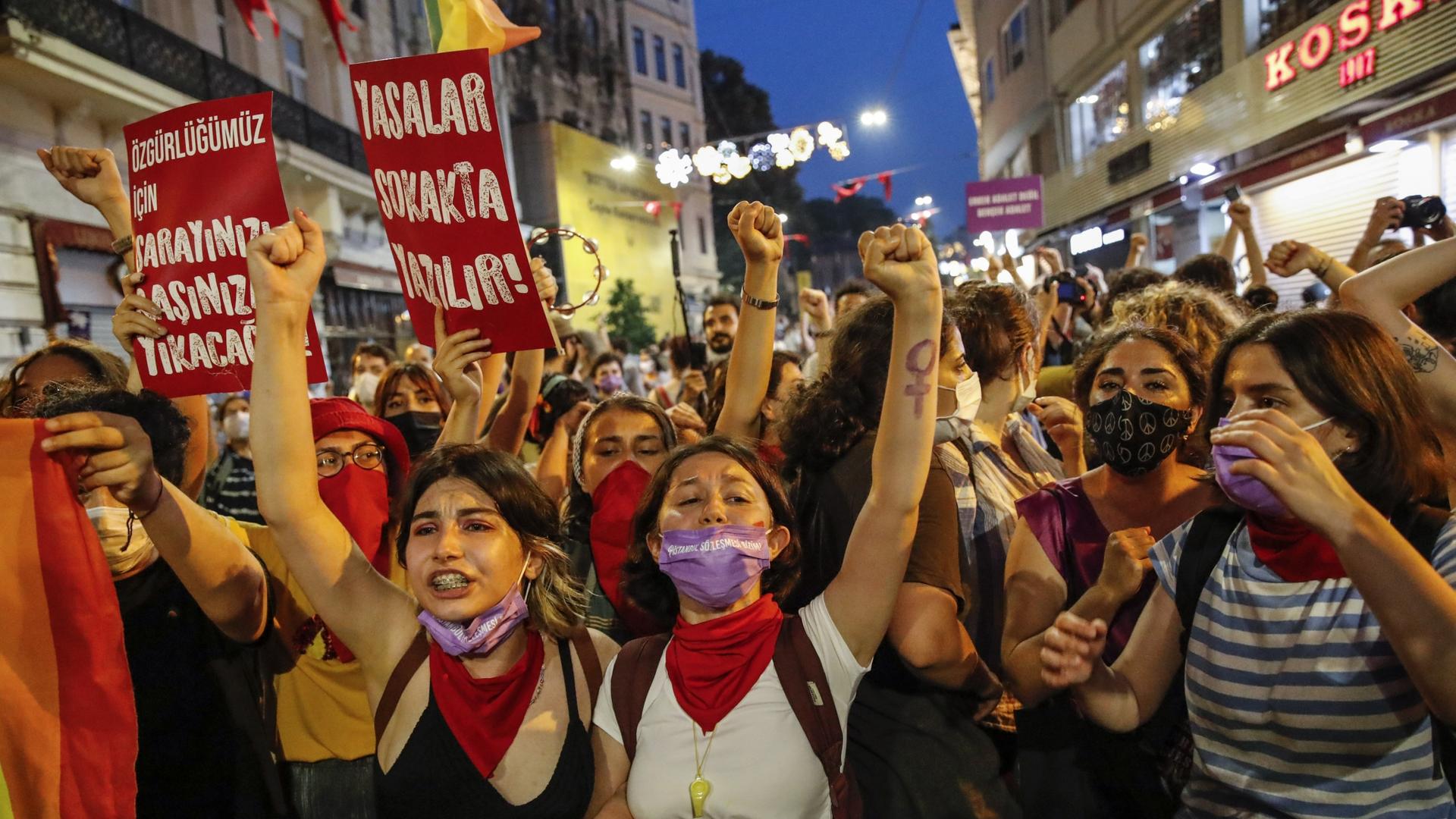 Protesters chant slogans against the government's decision to withdraw from Istanbul Convention
