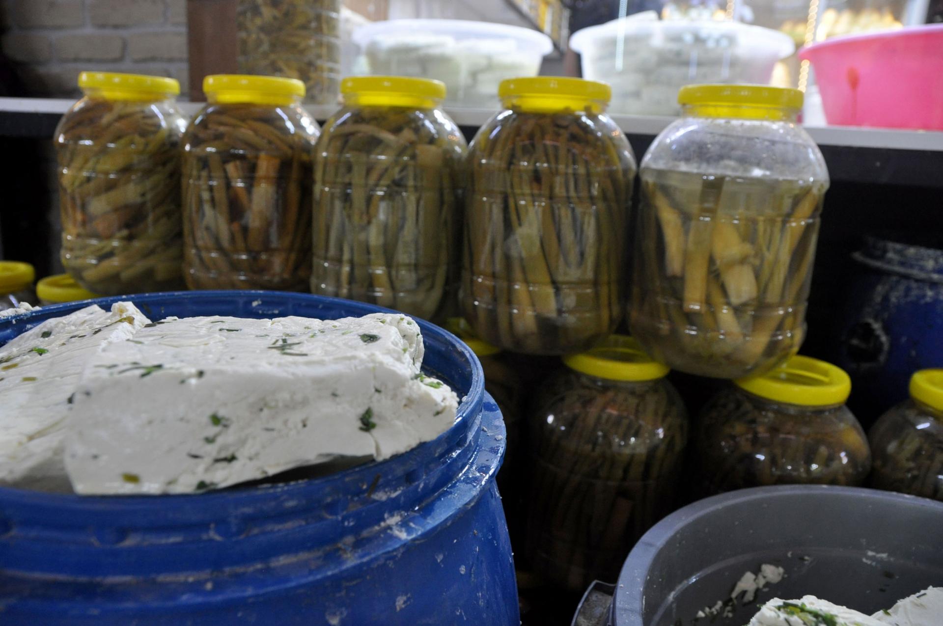 Plastic jugs of pickled wild herbs, used in local Van cheese, stand behind the star of the show. 