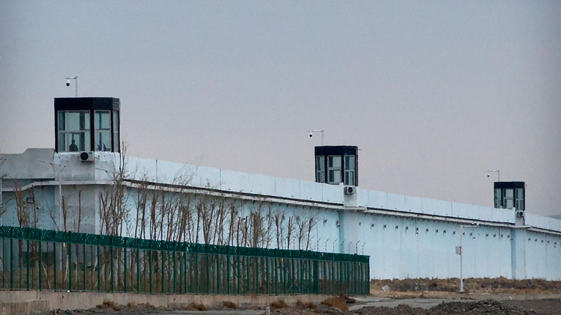 A person stands in a tower on the perimeter of the Number 3 Detention Center in Dabancheng in western China's Xinjiang Uyghur Autonomous Region on April 23, 2021. 