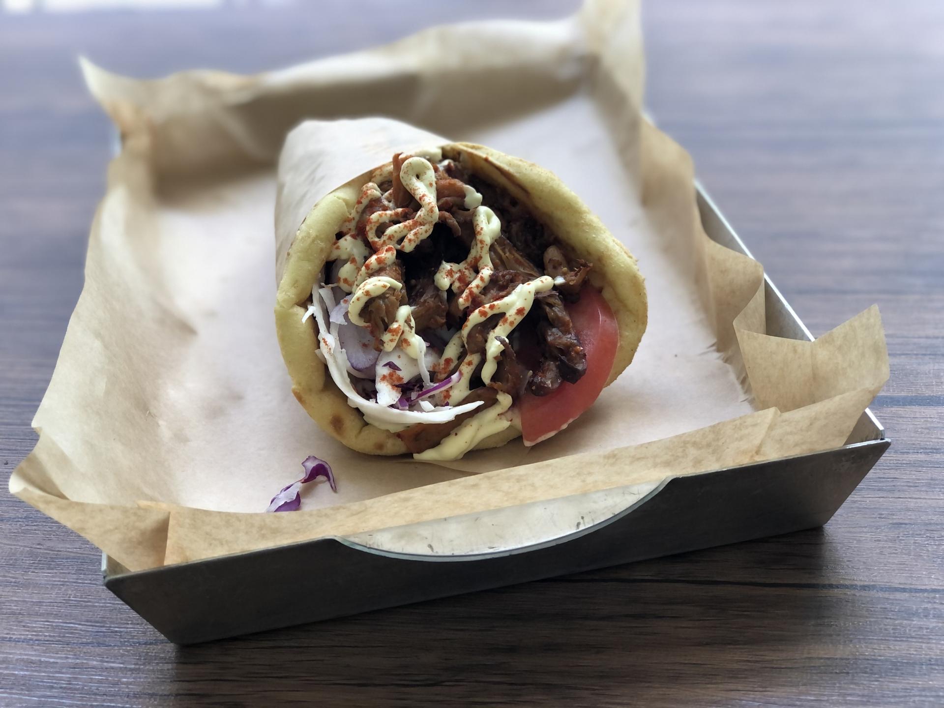 Vegan Beat’s gyro is stuffed with thinly sliced baked mushrooms, tomato, onion and vegan tzatziki sauce and mayonnaise.