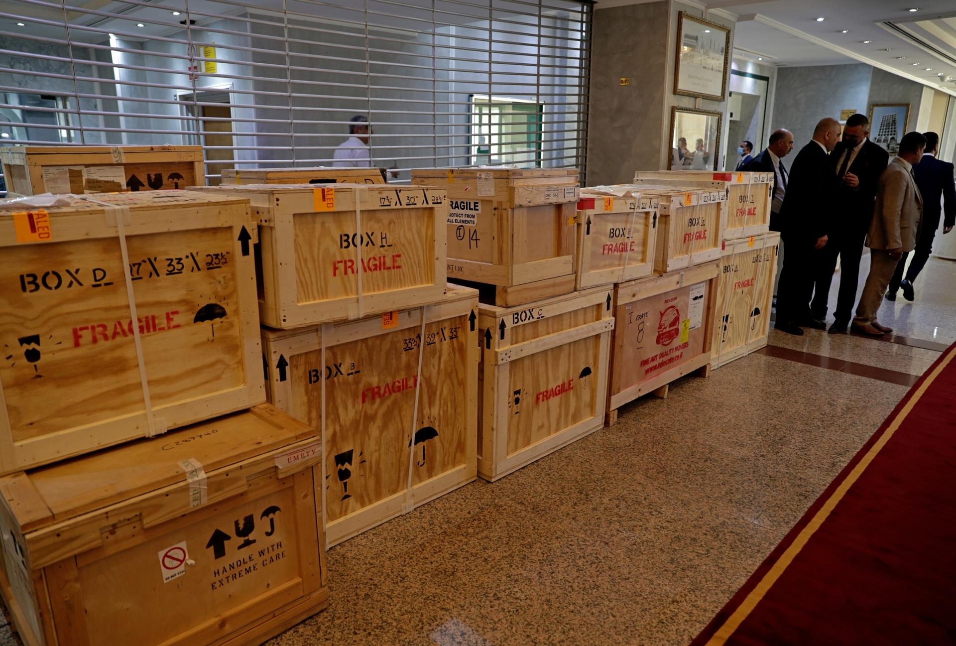 Boxes containing recovered looted artifacts sit temporarily at the foreign ministry before being transferred to the Iraq Museum, in Baghdad, Iraq, Tuesday, Aug. 3, 2021. 