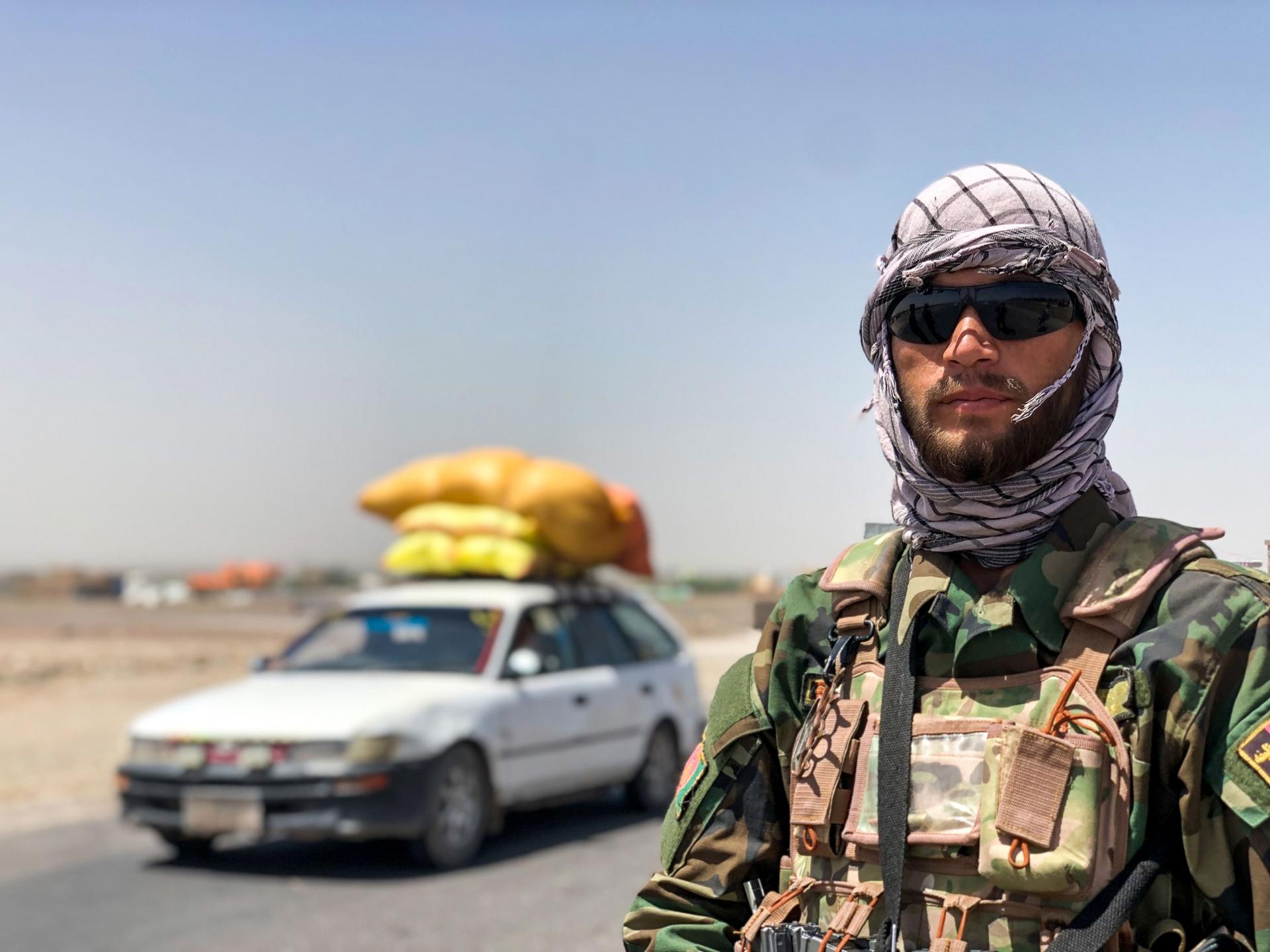 Ghand Agha, a member of the Afghan security forces has been manning a checkpoint at the entrance of Herat city for a month.
