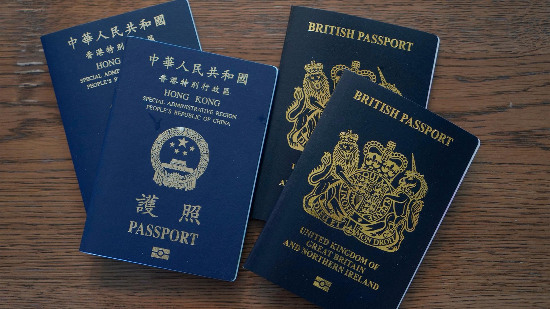 Blue British National Overseas passports (BNO) and Hong Kong Special Administrative Region of the People's Republic of China passports are displayed
