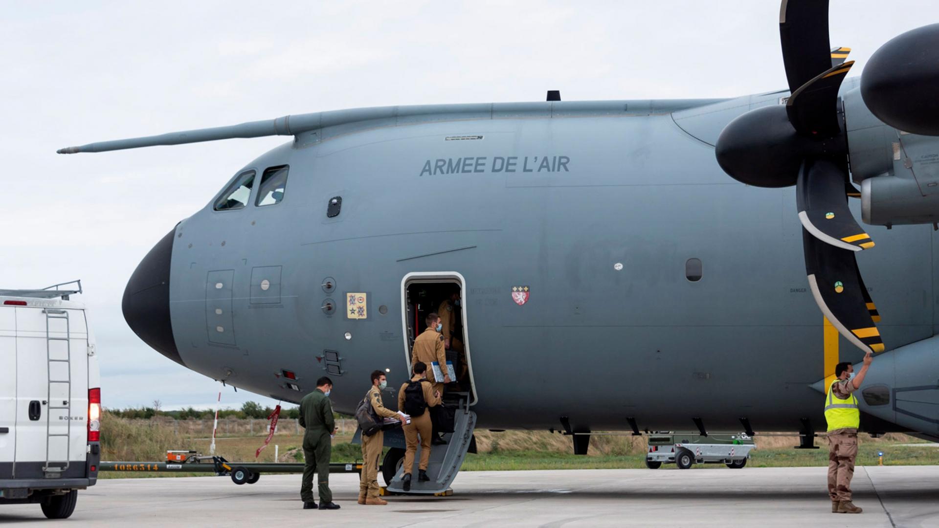 In this photo provided by the French Defense Ministry, French soldiers board a military Airbus A400M to evacuate French citizens from Afghanistan, Monday, Aug.16, 2021 in Orleans, central France.