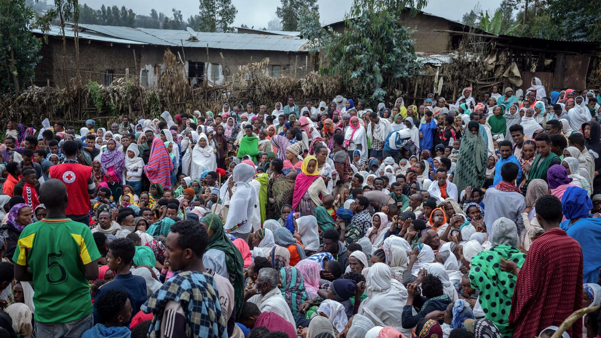 Displaced Ethiopians from different towns in the Amhara region wait for aid distributions at a center for the internally displaced in Debark, in the Amhara region of northern Ethiopia, Friday, Aug. 27, 2021. 