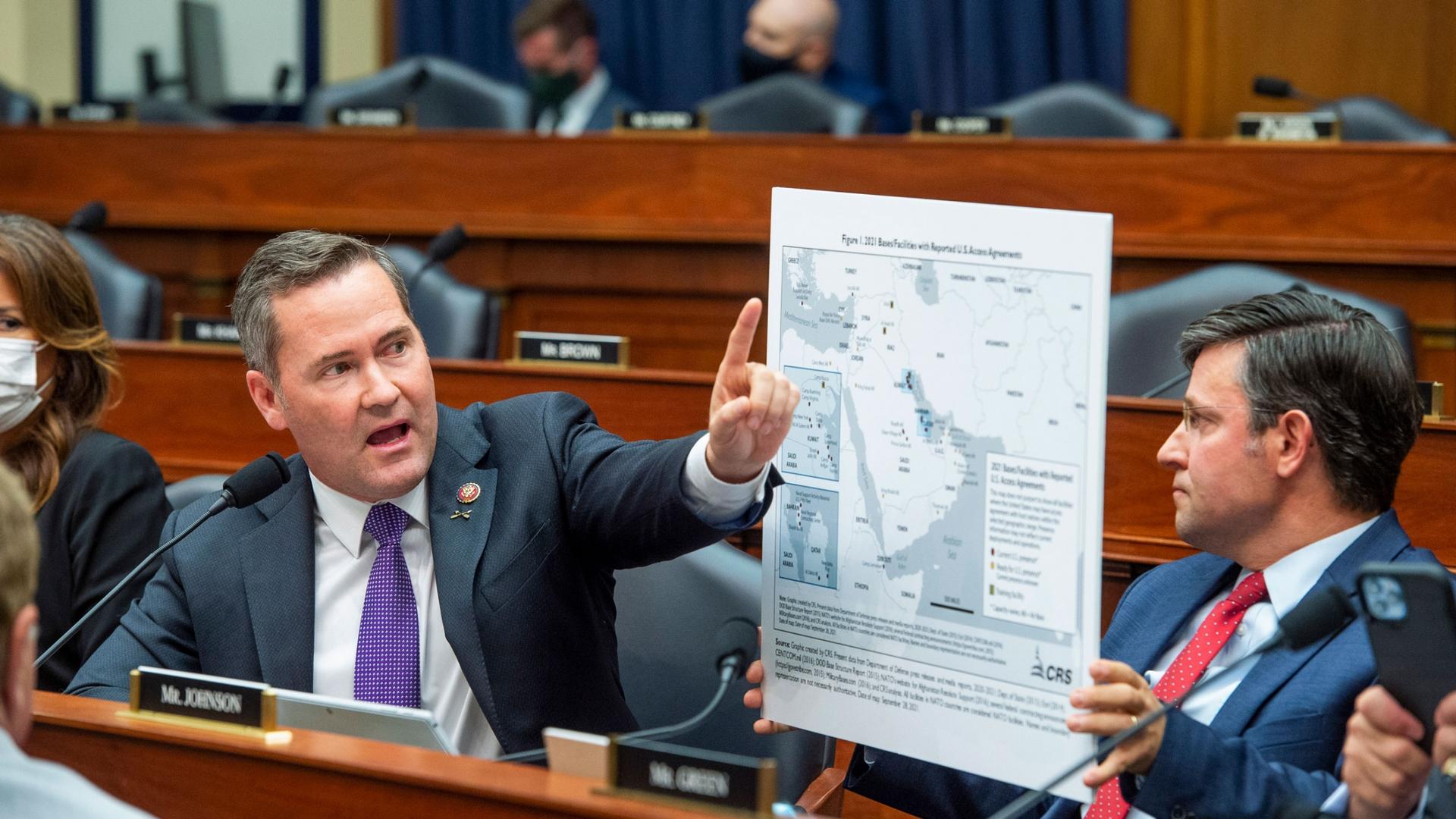Rep. Michael Waltz speaks as Rep. Mike Johnson displays a map during the House Armed Services Committee on the conclusion of military operations in Afghanistan and plans for future counterterrorism operations on Wednesday, Sept. 29, 2021,