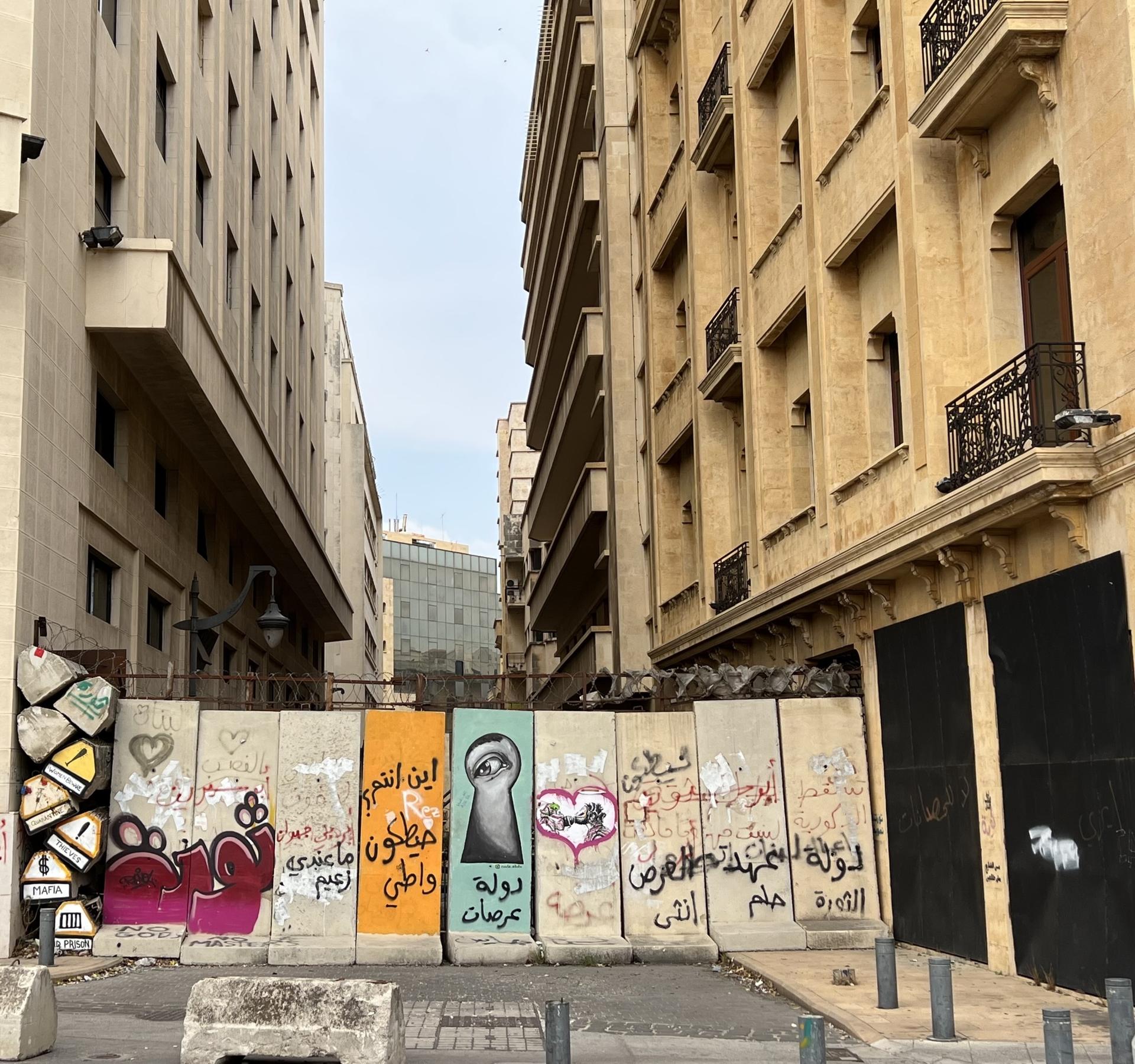 Some streets in Beirut have been barricaded by blast walls. Protesters use them as canvas for anti-government graffiti.