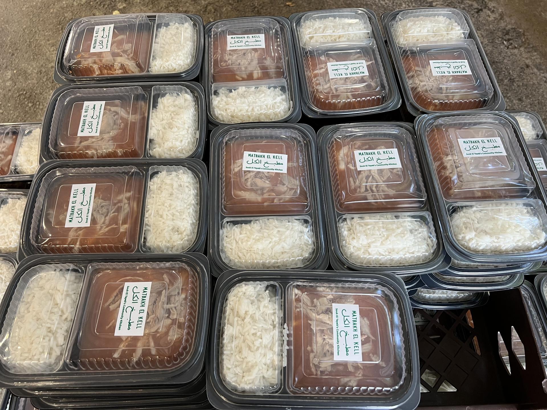Boxed meals of rice and chicken are ready to be delivered to a mosque in Beirut for distribution.