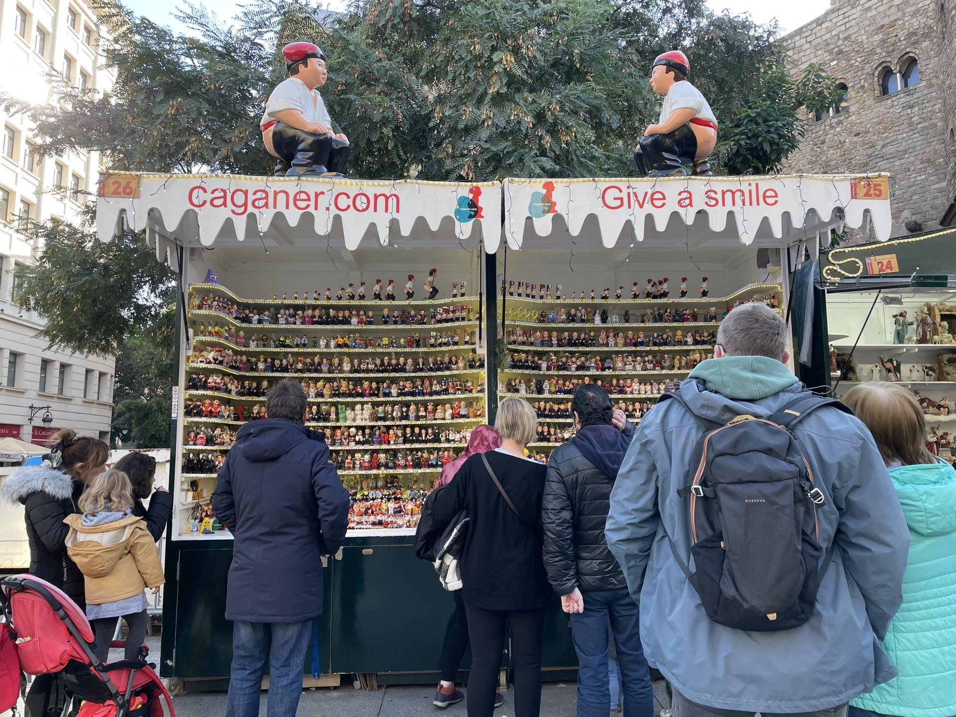 At Barcelona's oldest Christmas market, Fira de Santa Llúcia, Marc Alós sells handmade Caganers. His company, founded by his mother in 1992, now has more than 500 versions of the Caganer.