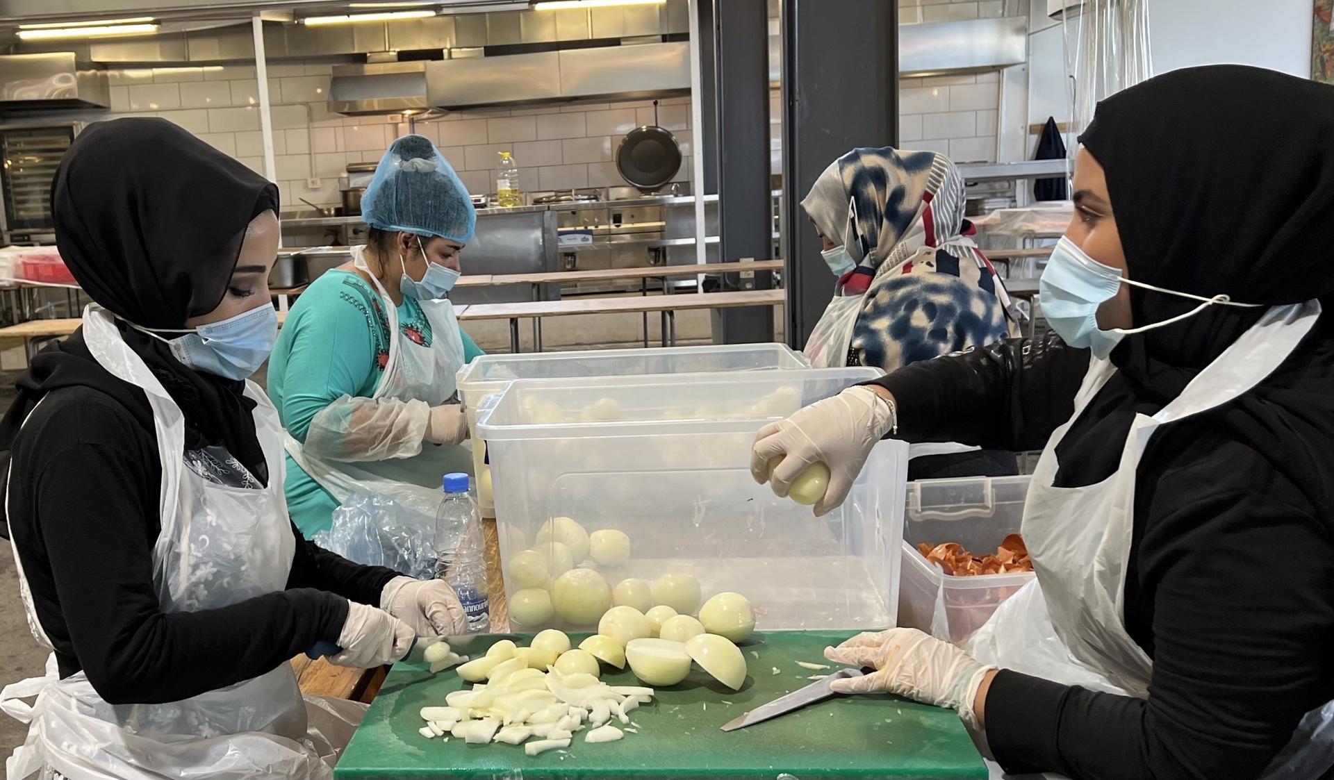 Workers prepare meals at the Matbakh El Kell Community Kitchen in Beirut.