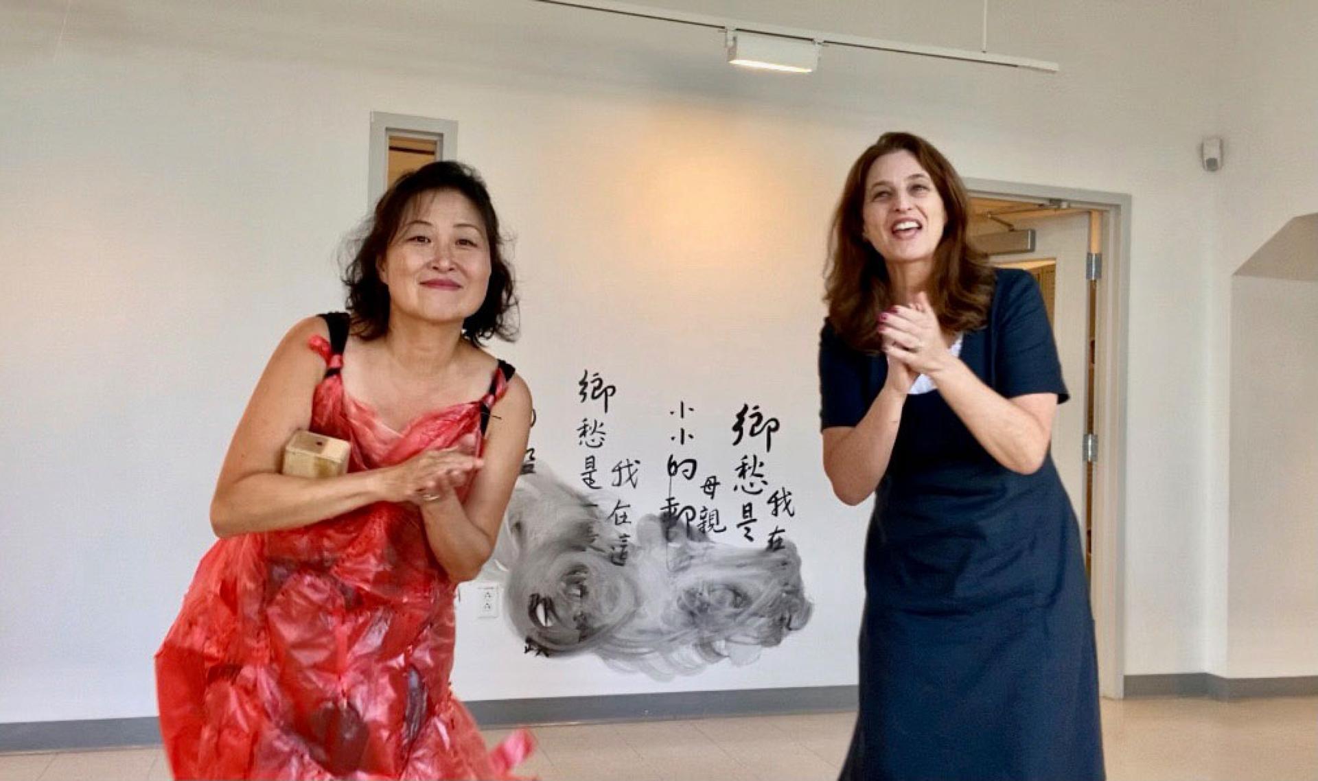 Taiwan-born artist Wen-hao (left) learns a song as part of her exhibit on immigration at Pao Arts Center, in Boston, Massachusetts.