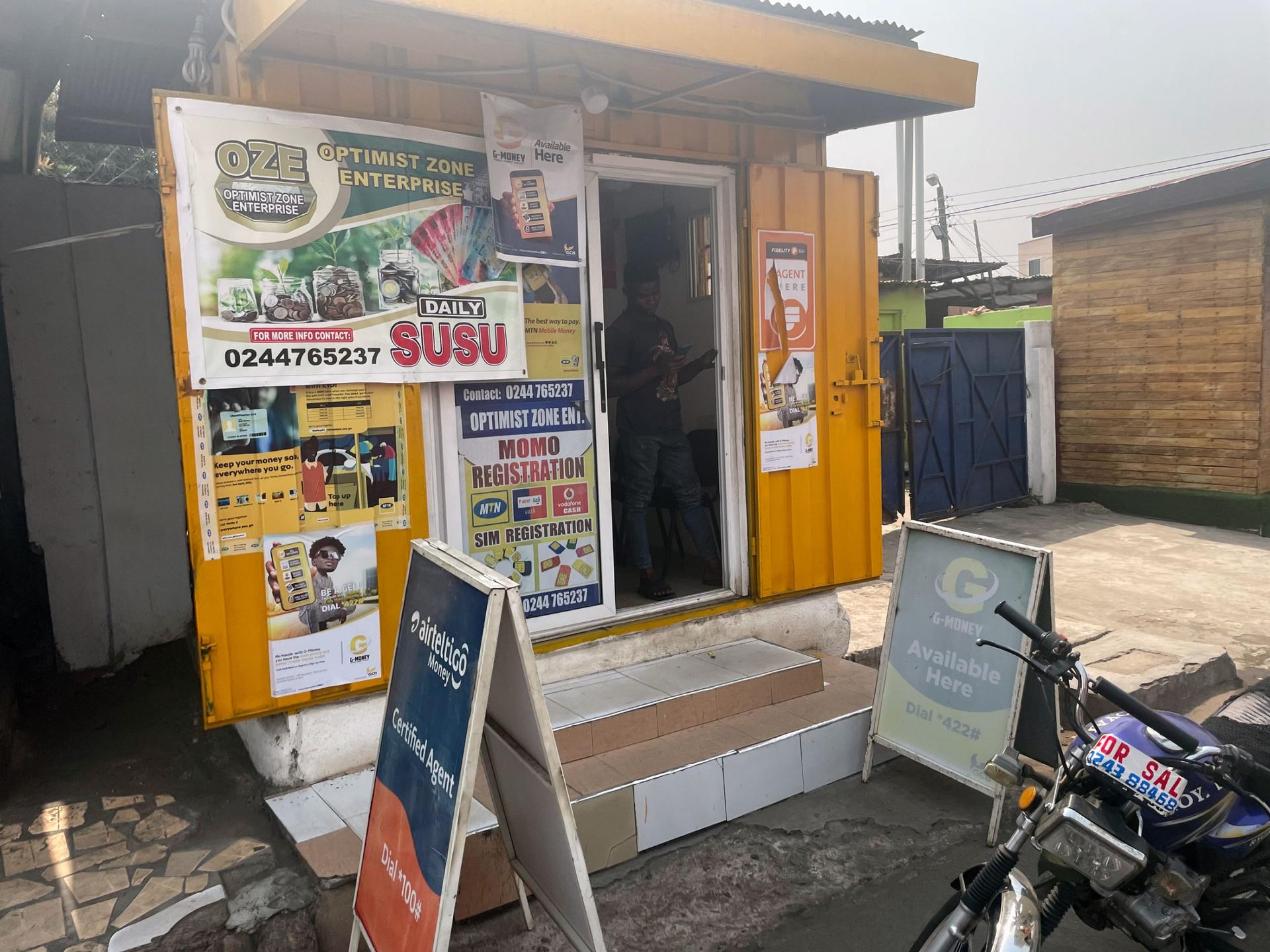Mobile money stands are go-to points for Ghana's unbanked. 