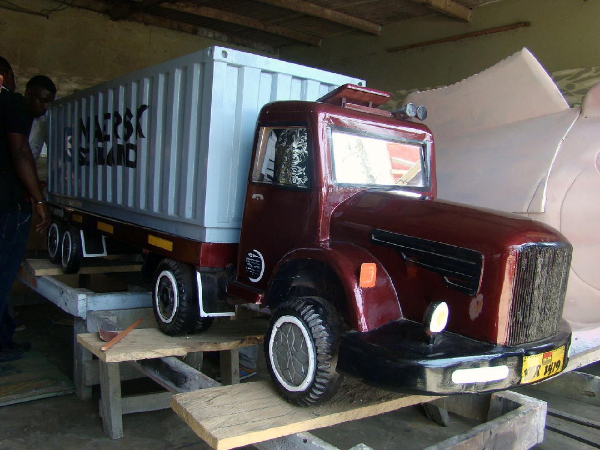 A truck-shaped coffin is made for a trucker who has died. 