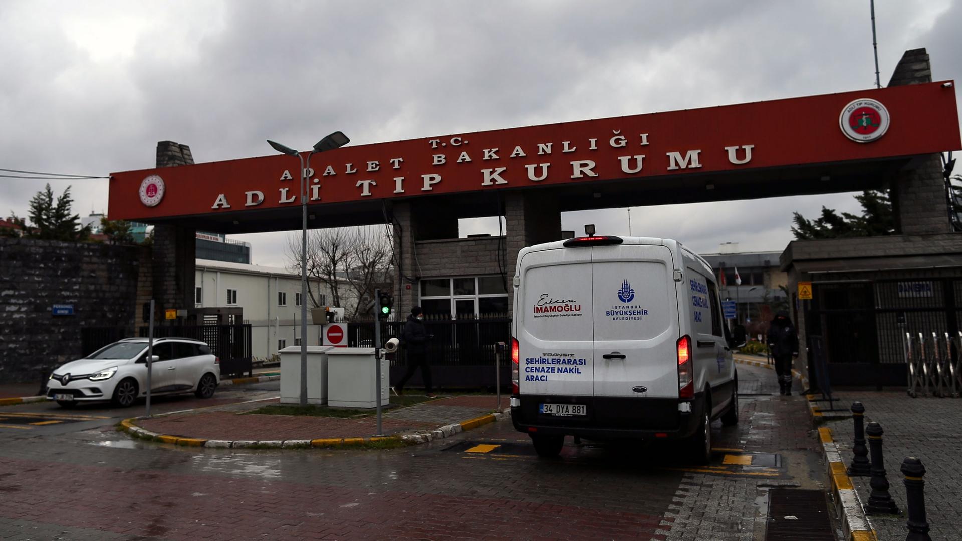 An ambulance carrying the bodies of victims enters the Medical Forensic Institution in Istanbul, Thursday, Feb. 3, 2022. 
