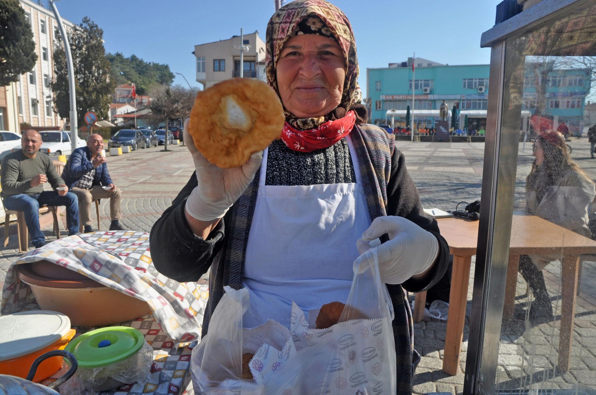 Sevinç Anne, or Mother Sevinç, sells homemade rounds of fried dough in Ipsala’s main square. 