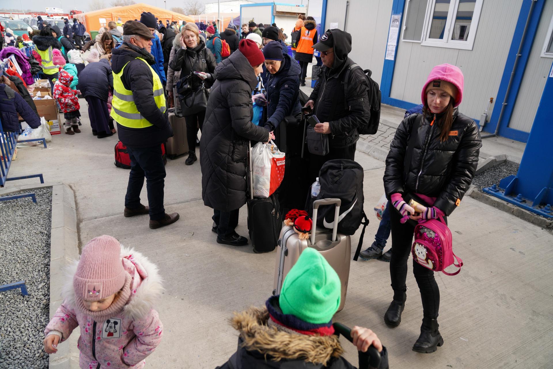 Once at customs in Isaccea, on Romania's southern border, Ukrainian refugees are directed to inflatable orange tents serving hot tea and sandwiches while they wait to go through passport control.