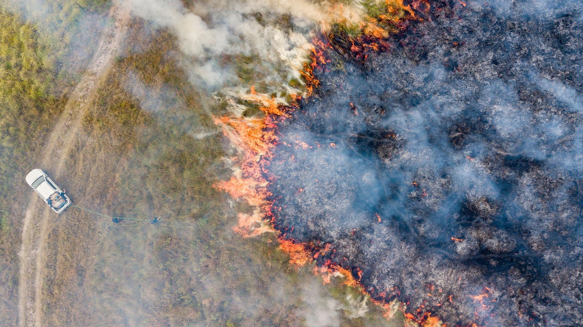 Aerial shot of wildfires burning parts of the Iberá wetlands in northern Argentina