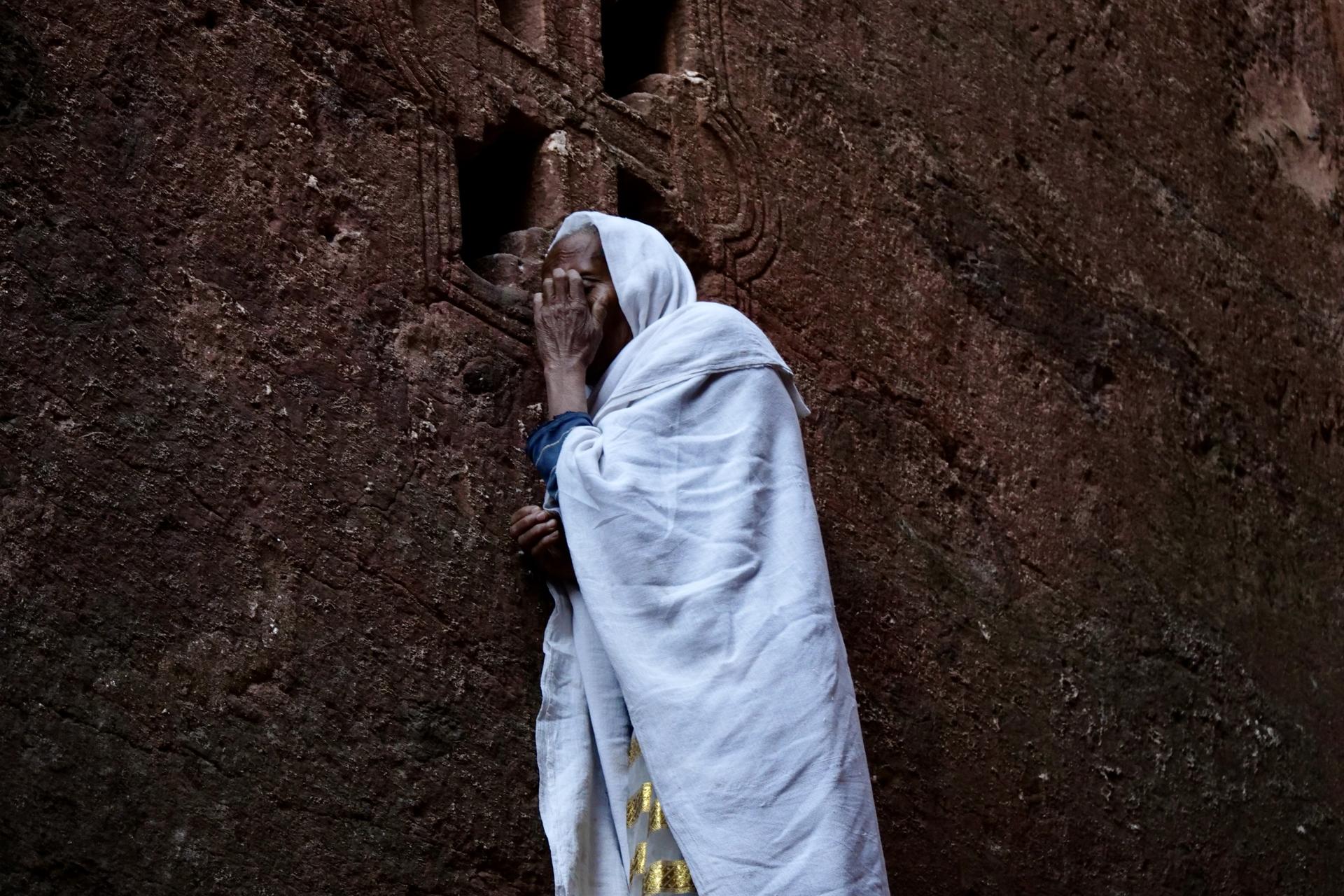 Woman praying at the 13th-century rock churches of Lalibela, Ethiopia, Feb. 16, 2022.