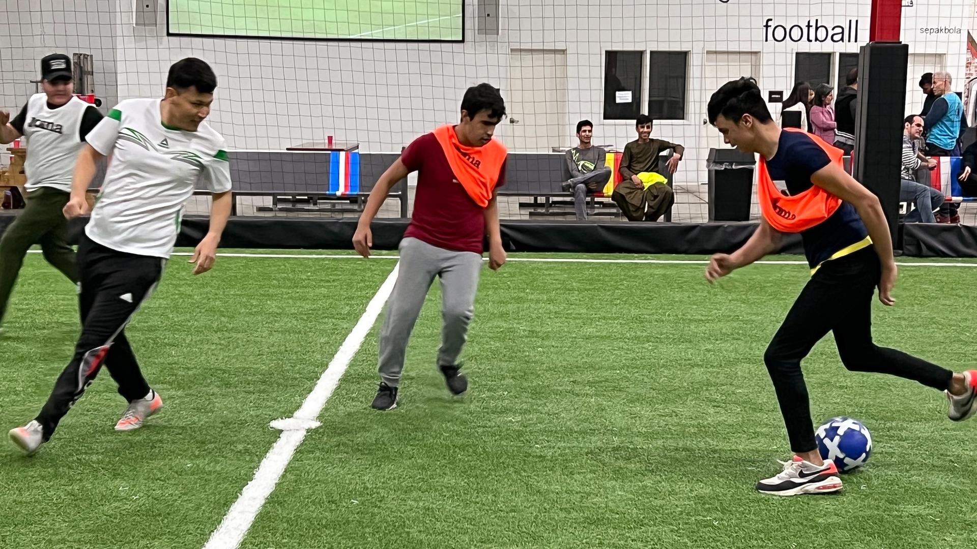 Some of the older Afghan children play soccer at STL Futbol Club on a recent Saturday. The weekly program will extend through the end of April.