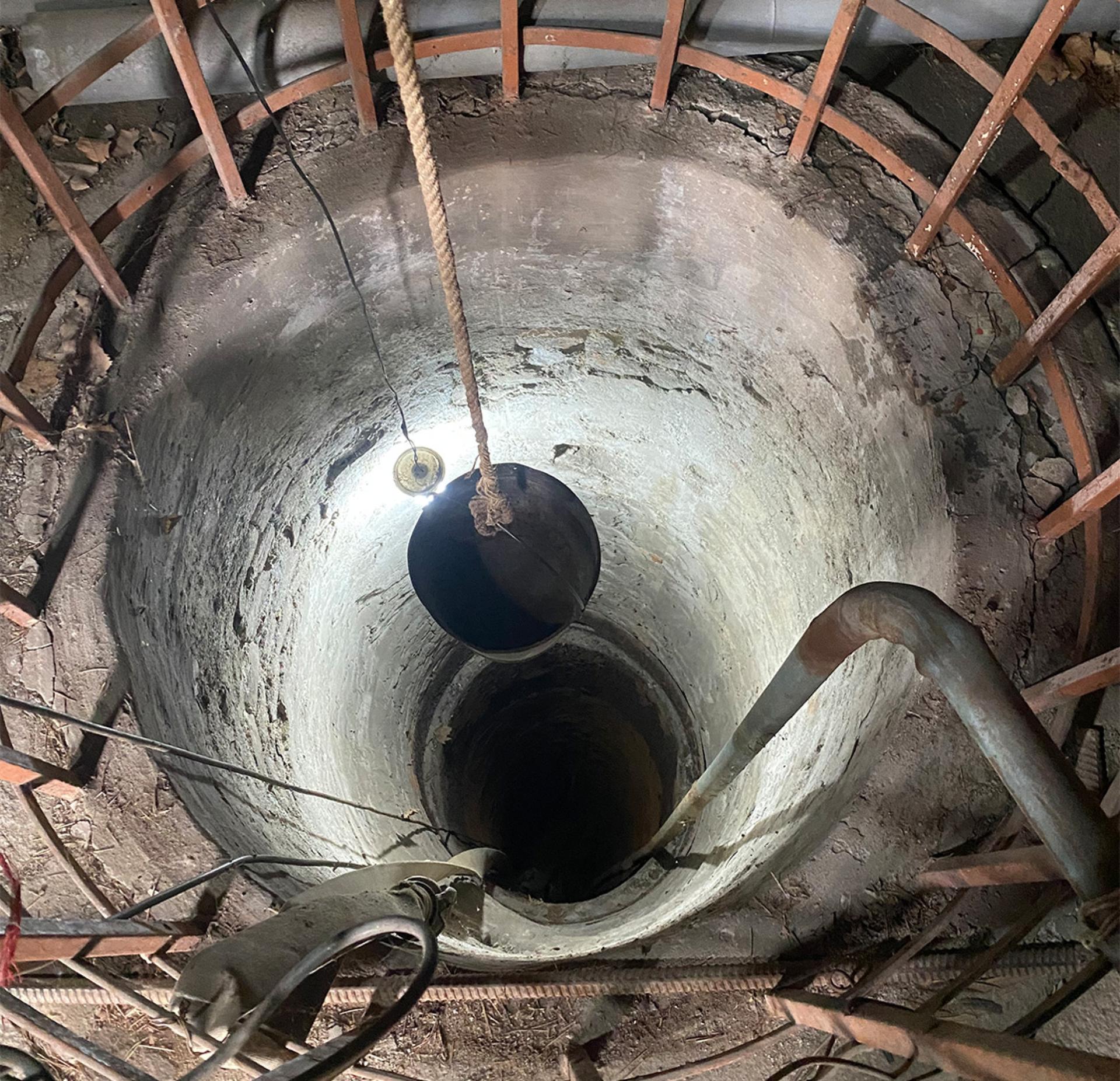 A rope plunges into a well at a Soviet-era museum in Tbilisi, Georgia.