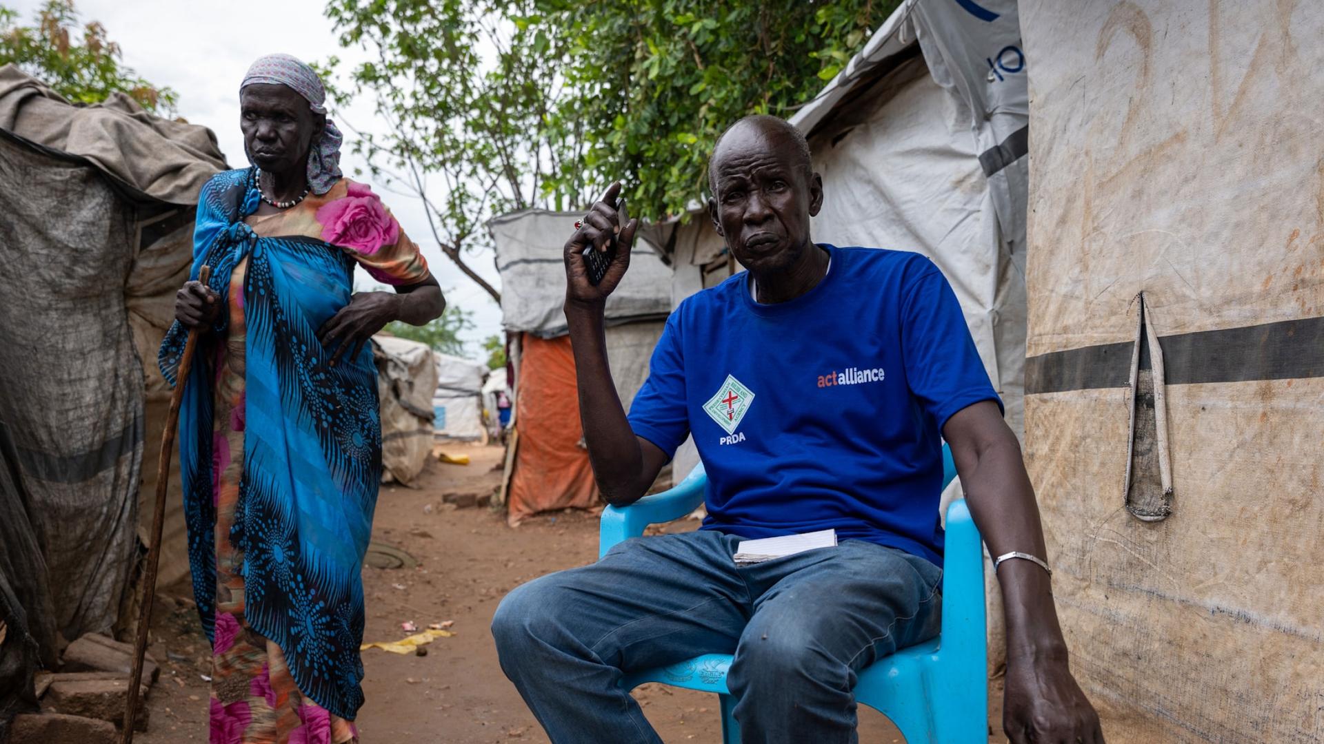 Community leader Nyouon Kew Riek sits outside his tent in Camp 2, Juba, South Sudan.