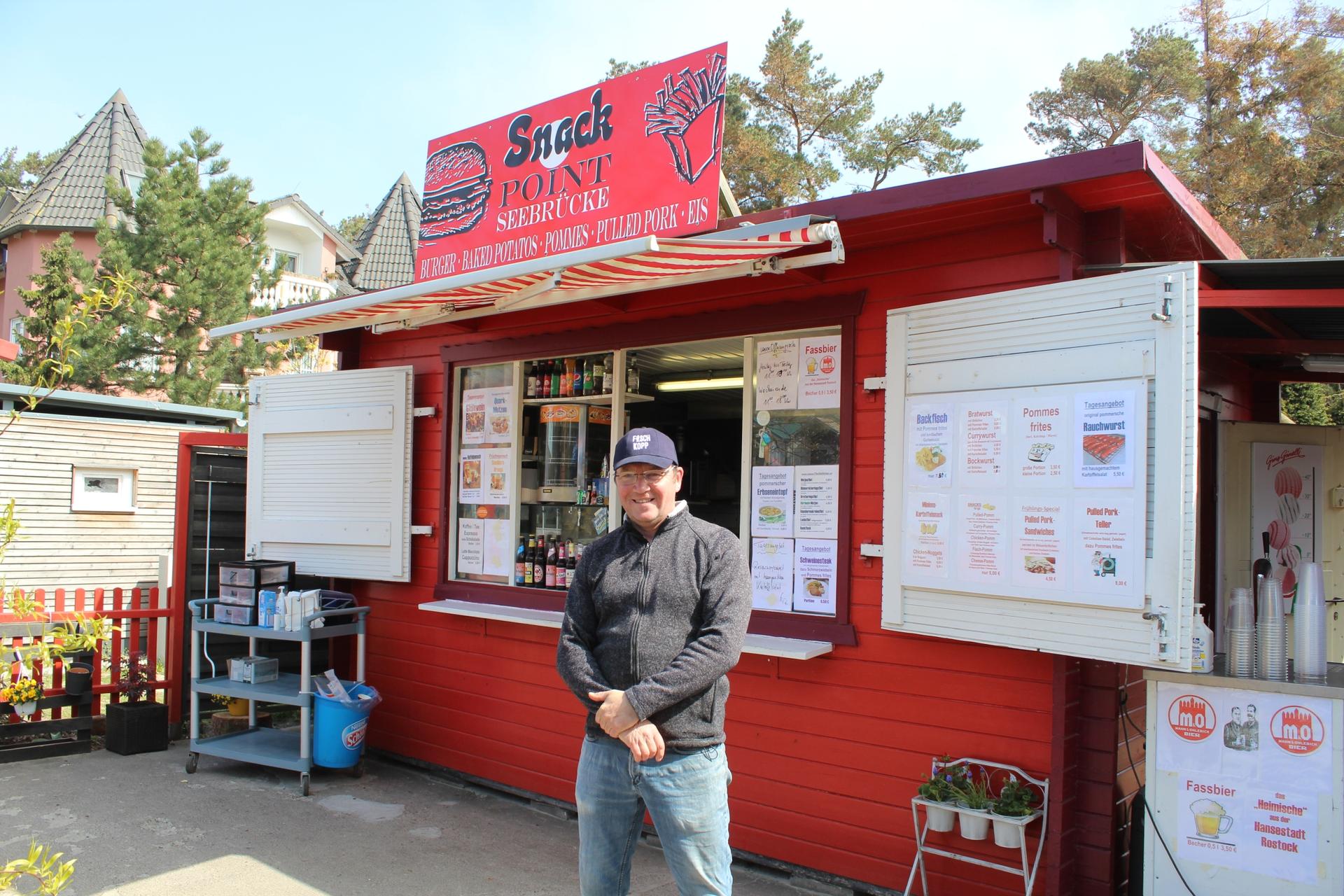 Thilo Siegert owns a catering company in town and serves fried dough and fish sandwiches at a snack stand off the town’s boardwalk. 