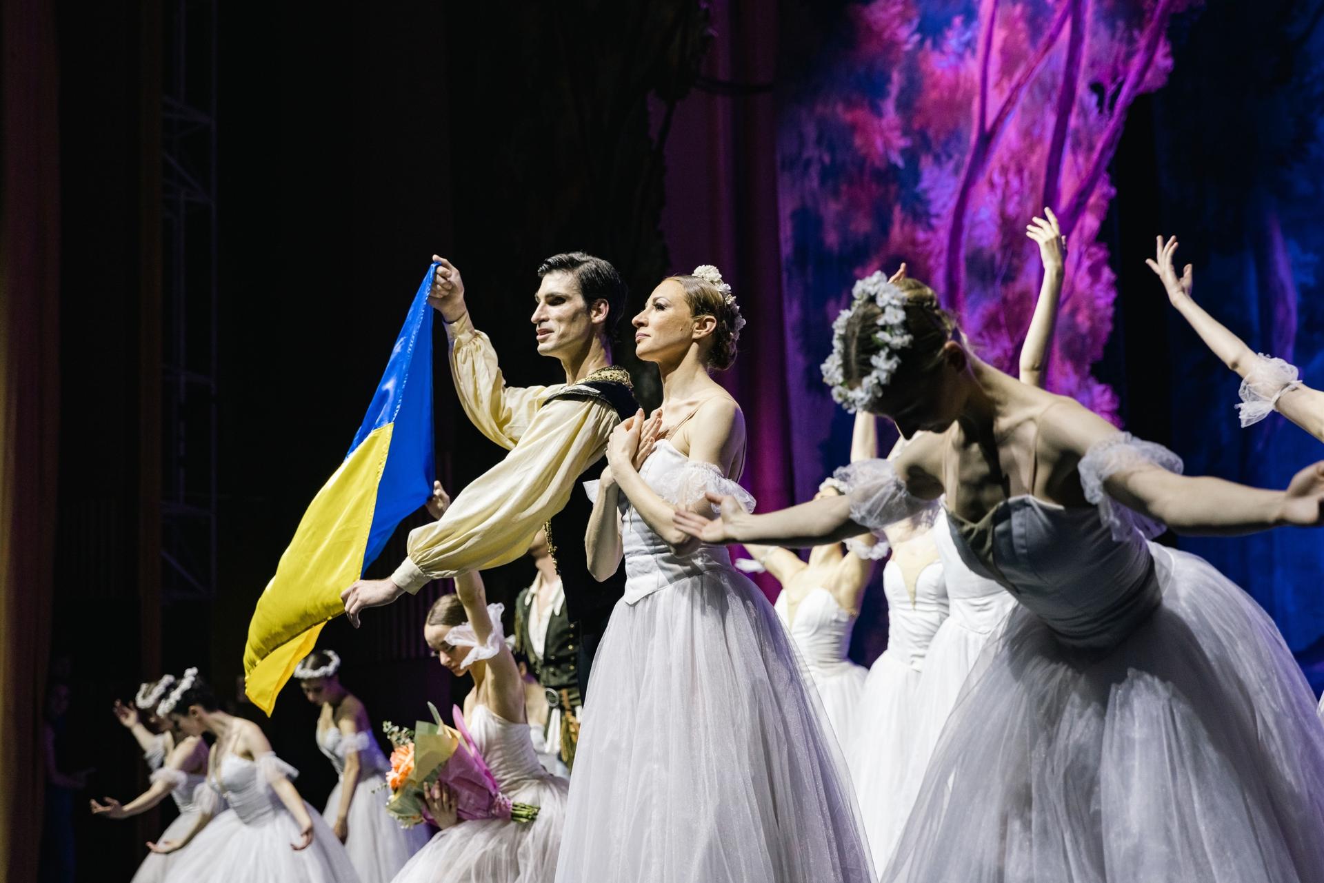 The Ukrainian Classical Ballet company bows with the Ukrainian flag following the playing of the Ukrainian national anthem in Bucharest, Ukraine.