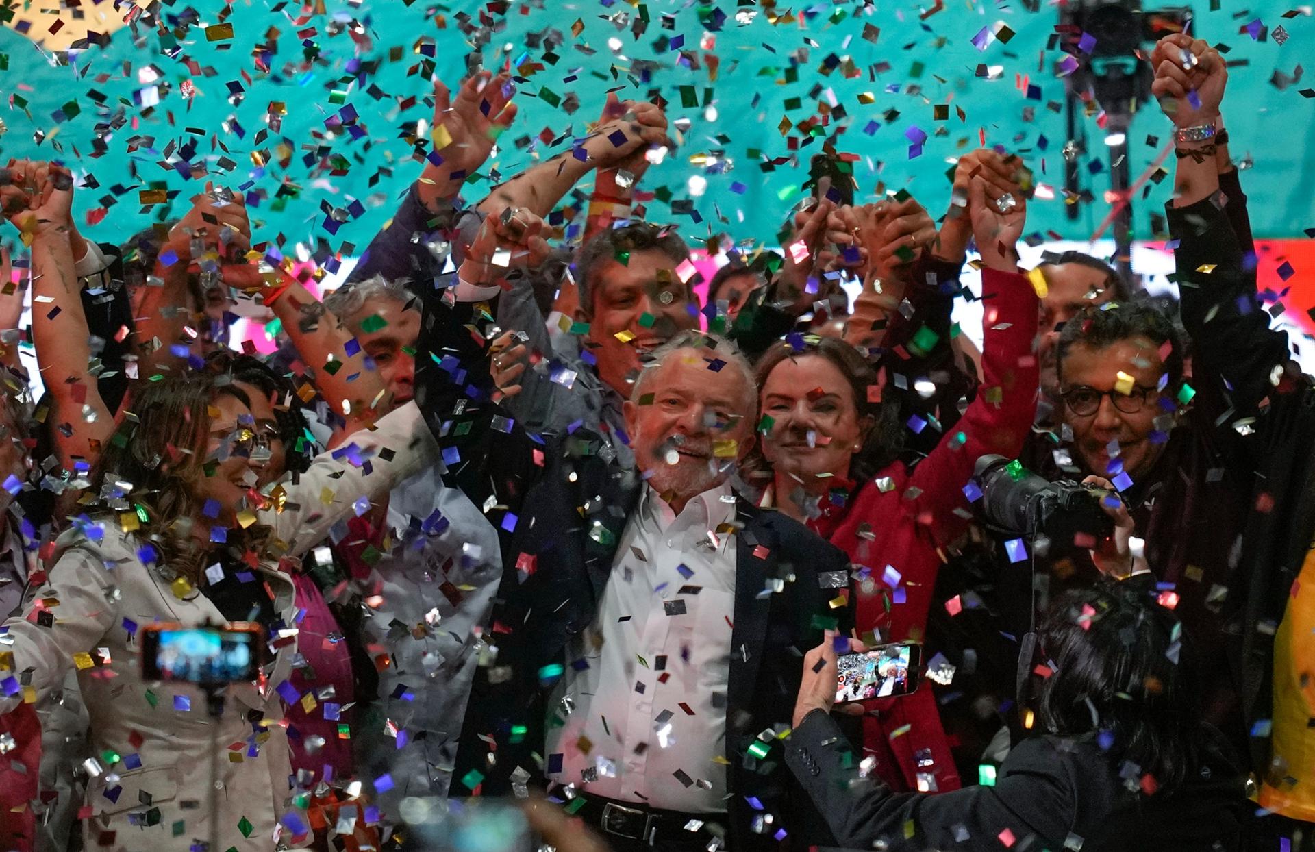 Confetti showers former Brazilian President Luiz Inácio Lula da Silva and supporters after the announcement of his candidacy for the country’s upcoming presidential election, in São Paulo, Brazil, Saturday, May 7, 2022.