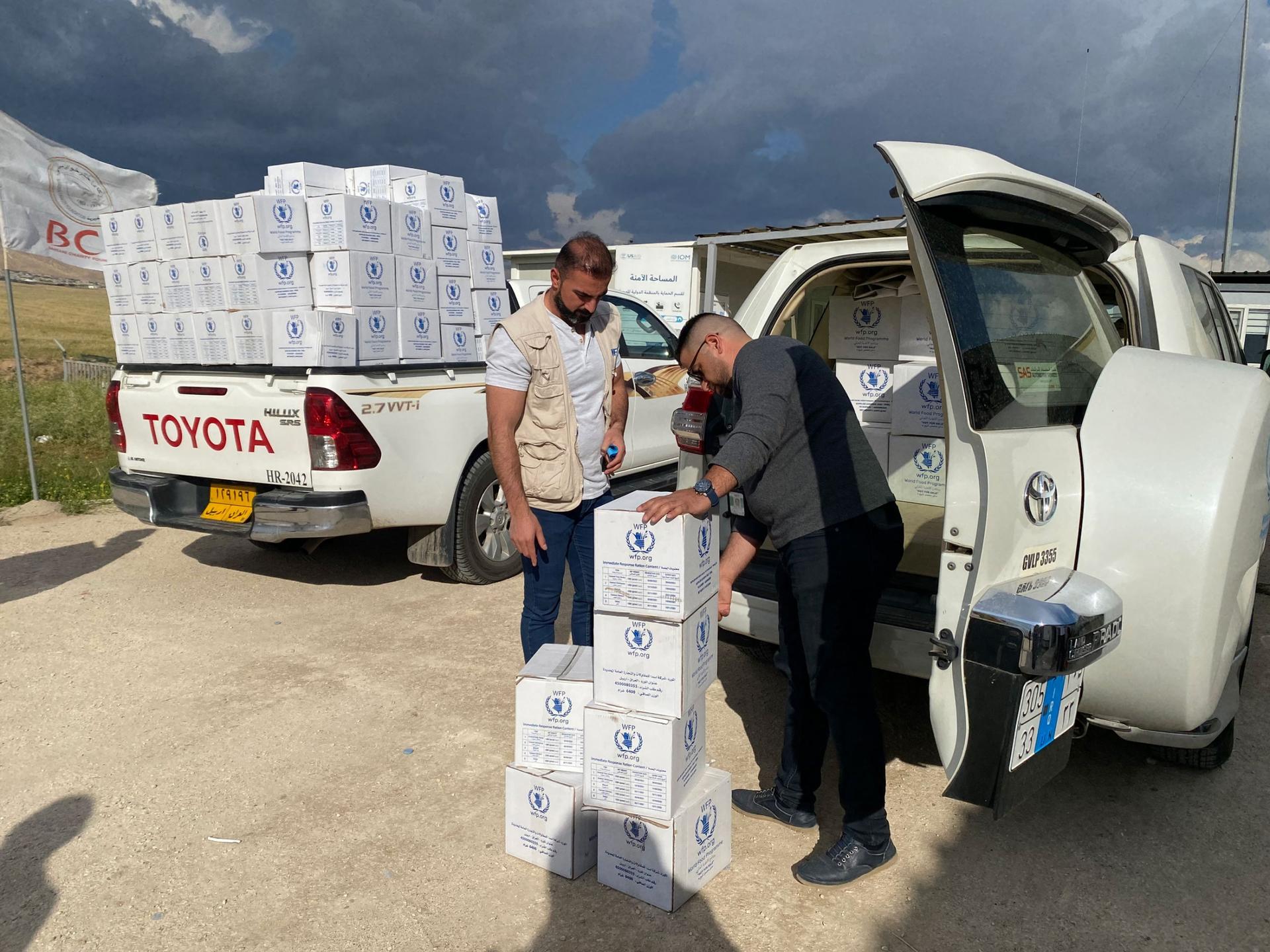 Food aid is delivered to Sharya camp in the semi-autonomous Kurdistan Region of Iraq, home to thousands of displaced Yazidis. 